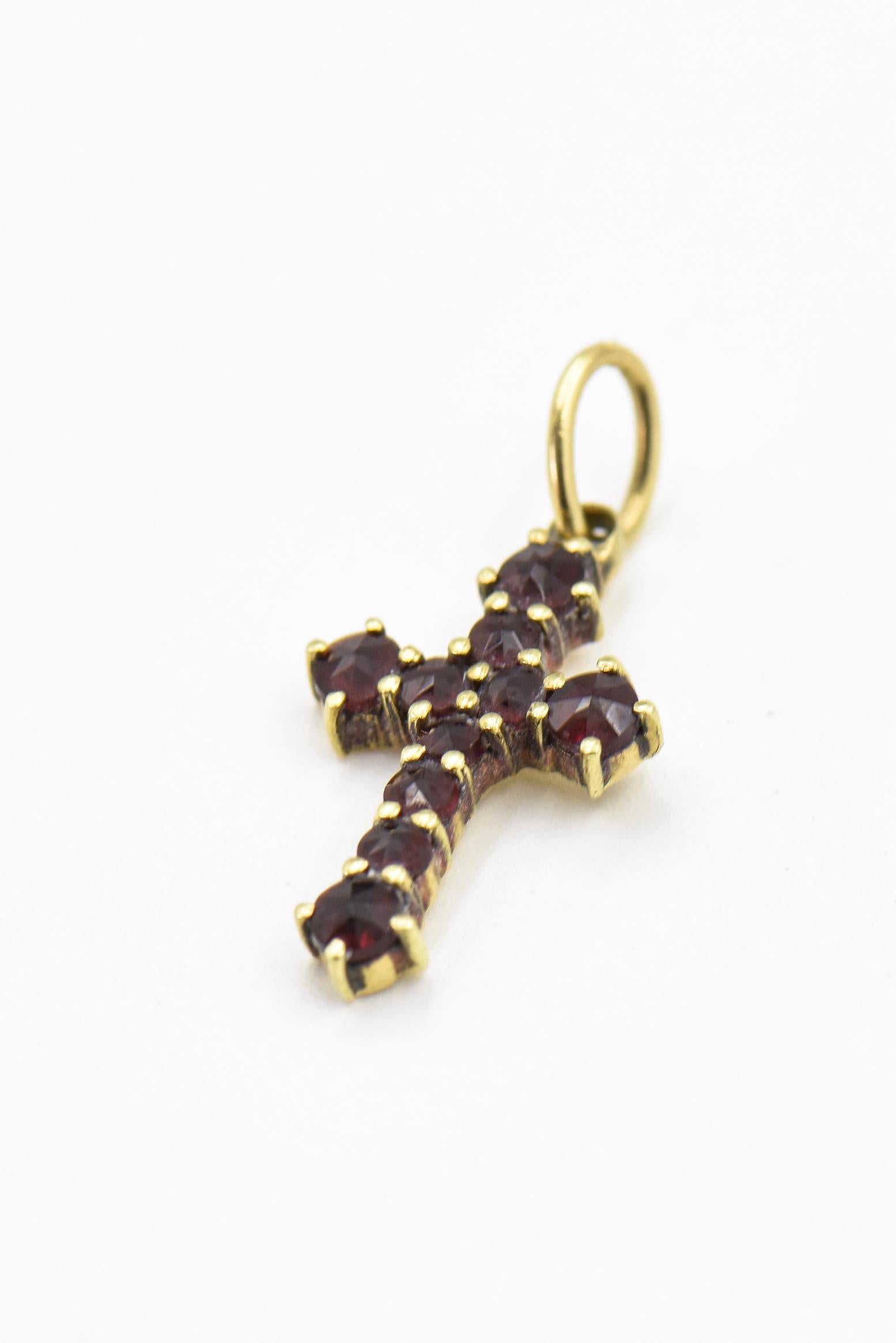 Sweet  18k yellow gold cross featuring 10 prong set faceted garnets.  Tests 18k with acid and gun - unmarked.  The loop hole is 4.35 mm x 2.89mm. Without the loop it is .60