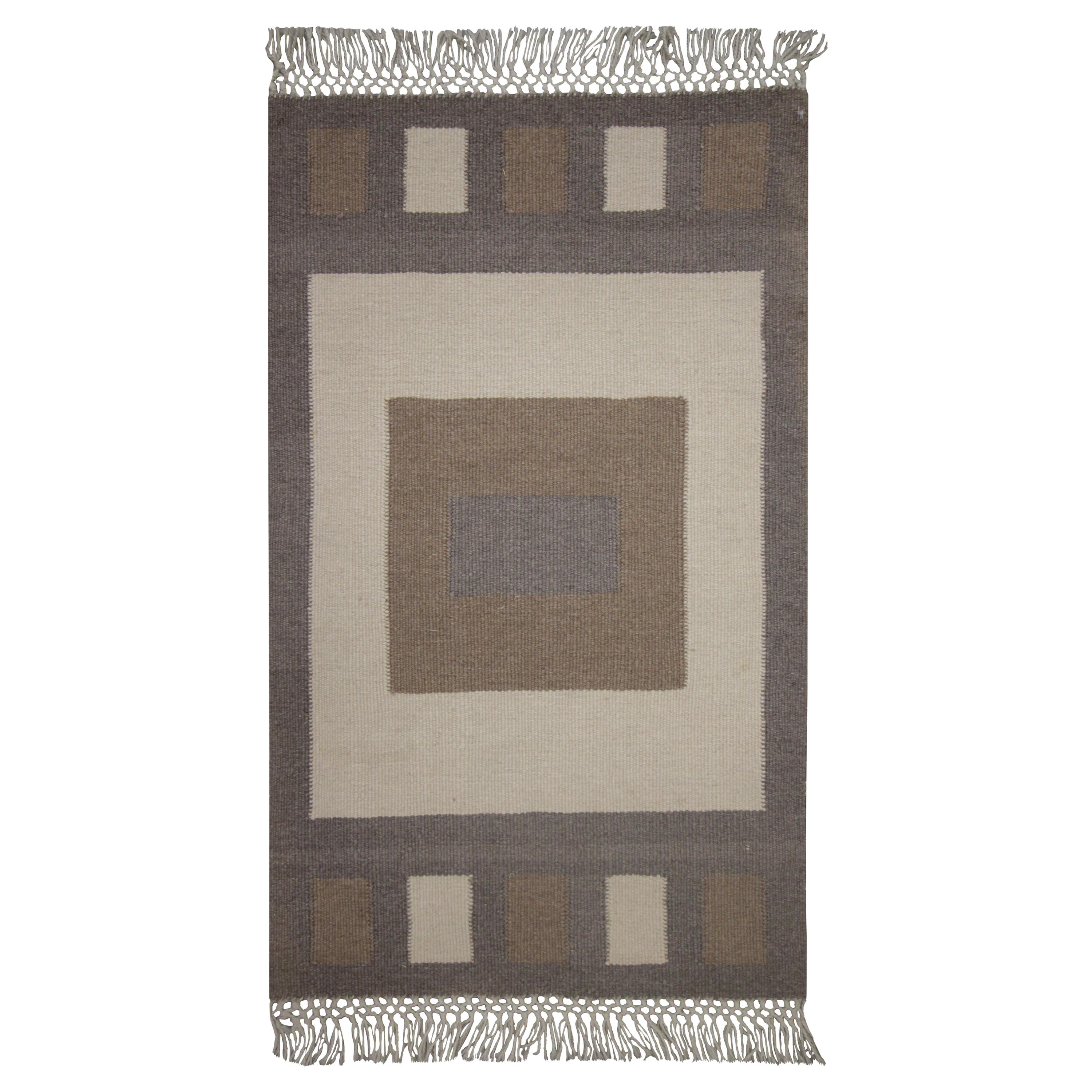 Moderner handgefertigter grau-beigefarbener Teppich aus Wolle mit geometrischem Muster
