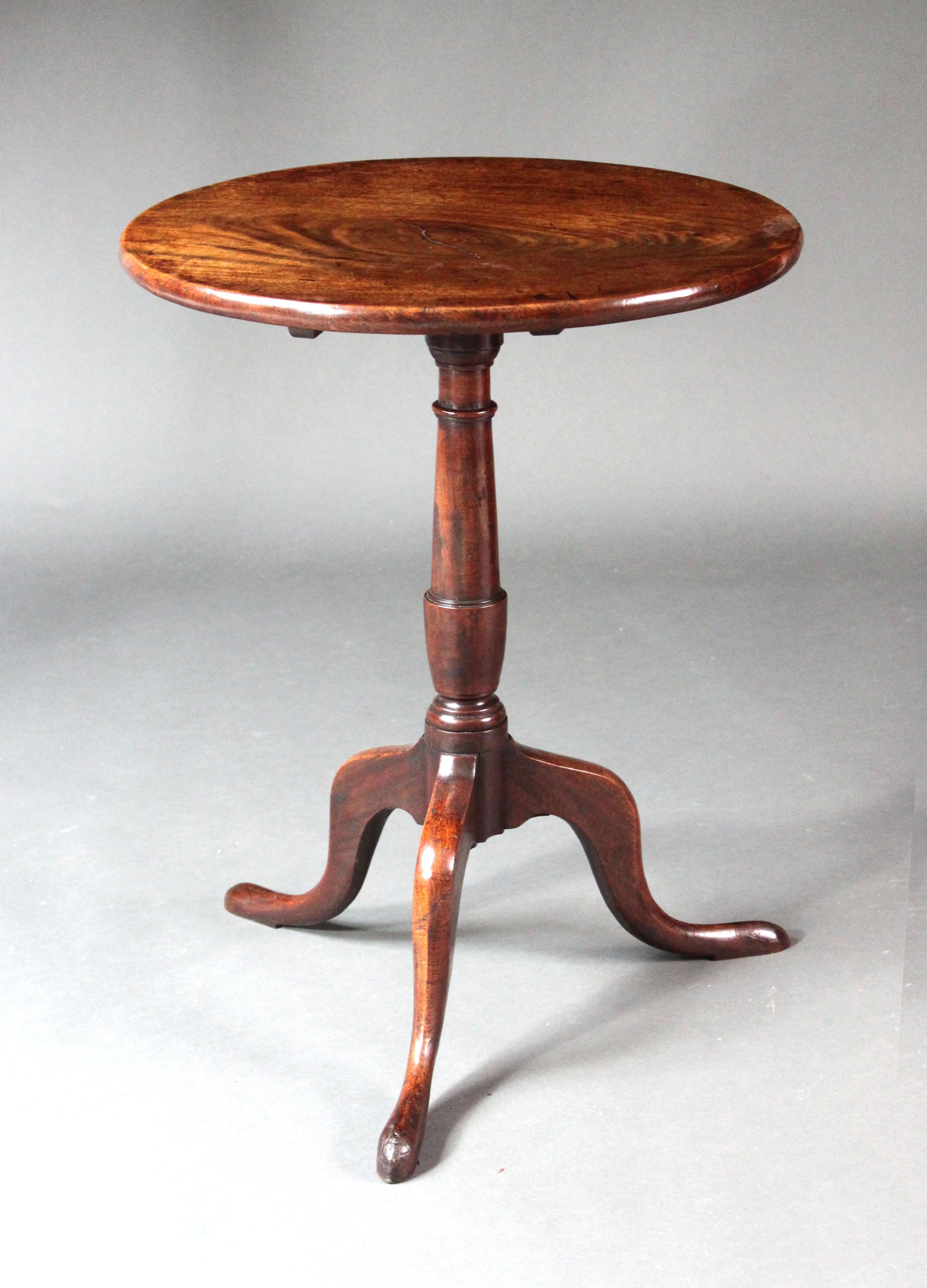 A George III Chippendale period tripod table of a good small size and figured one piece top.