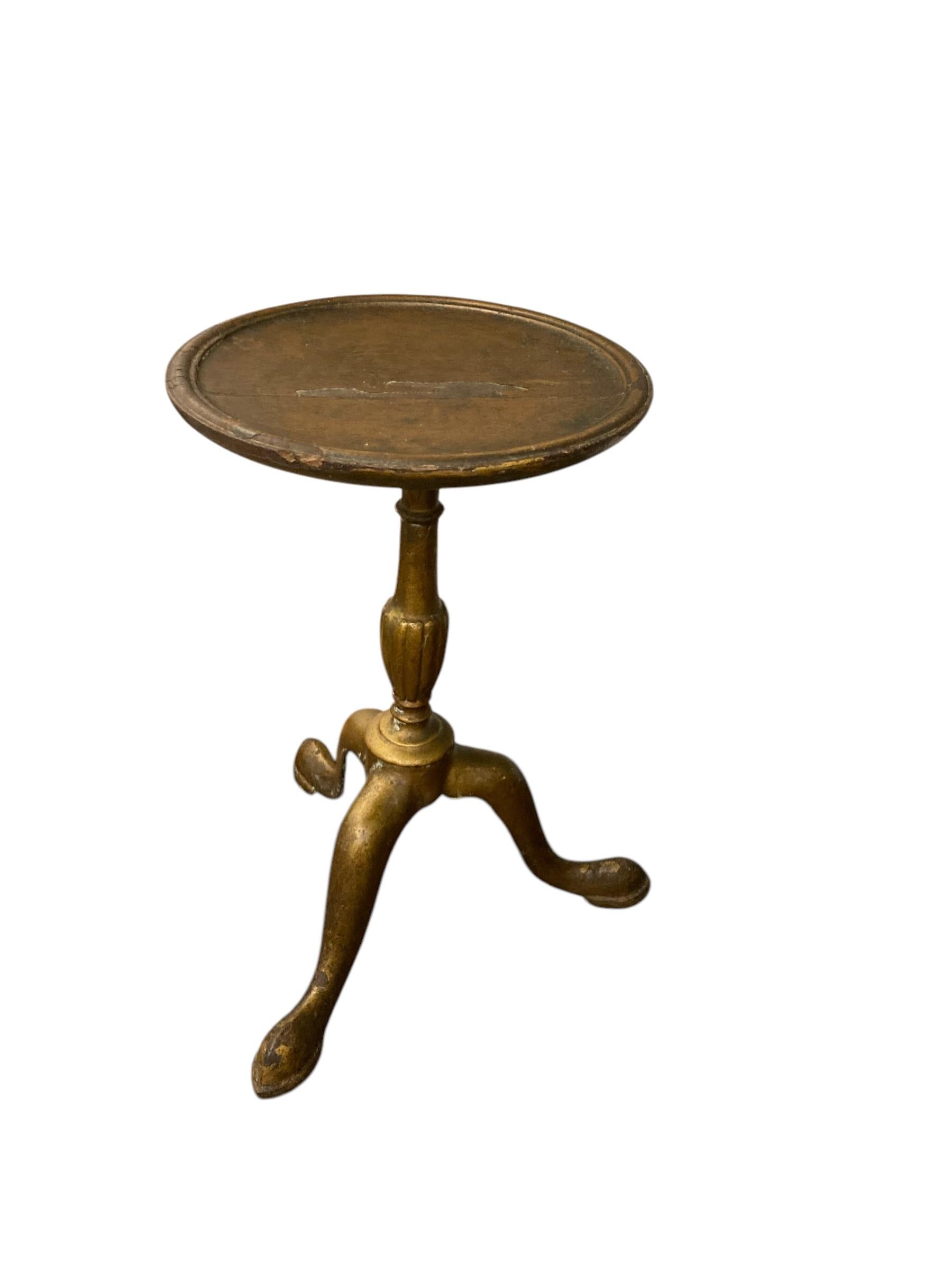 Small Georgian Brass Wine Table or Jardinere on Tri Legs wooden top. CIRCA 1850 Has some overall patina thats adds to its character. A lovely small table or plant stand. Has a heavy feel thats adds quality.

H: 40cm

Top W: 24cm

Bottom W: 30cm