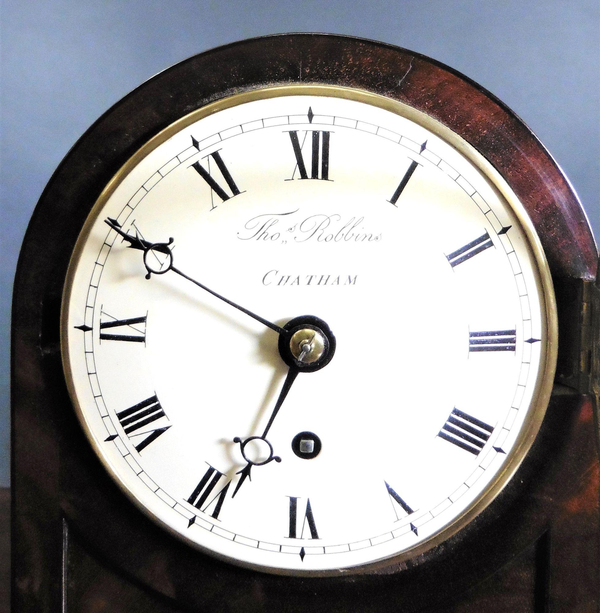 Small Georgian Bracket Clock by Thomas Robbins, Chatham
Fine mahogany arch top case standing on a raised, moulded plinth and resting on four brass ball feet with red silk lined fishscale frets to each side.
Convex brass bezel with convex glass