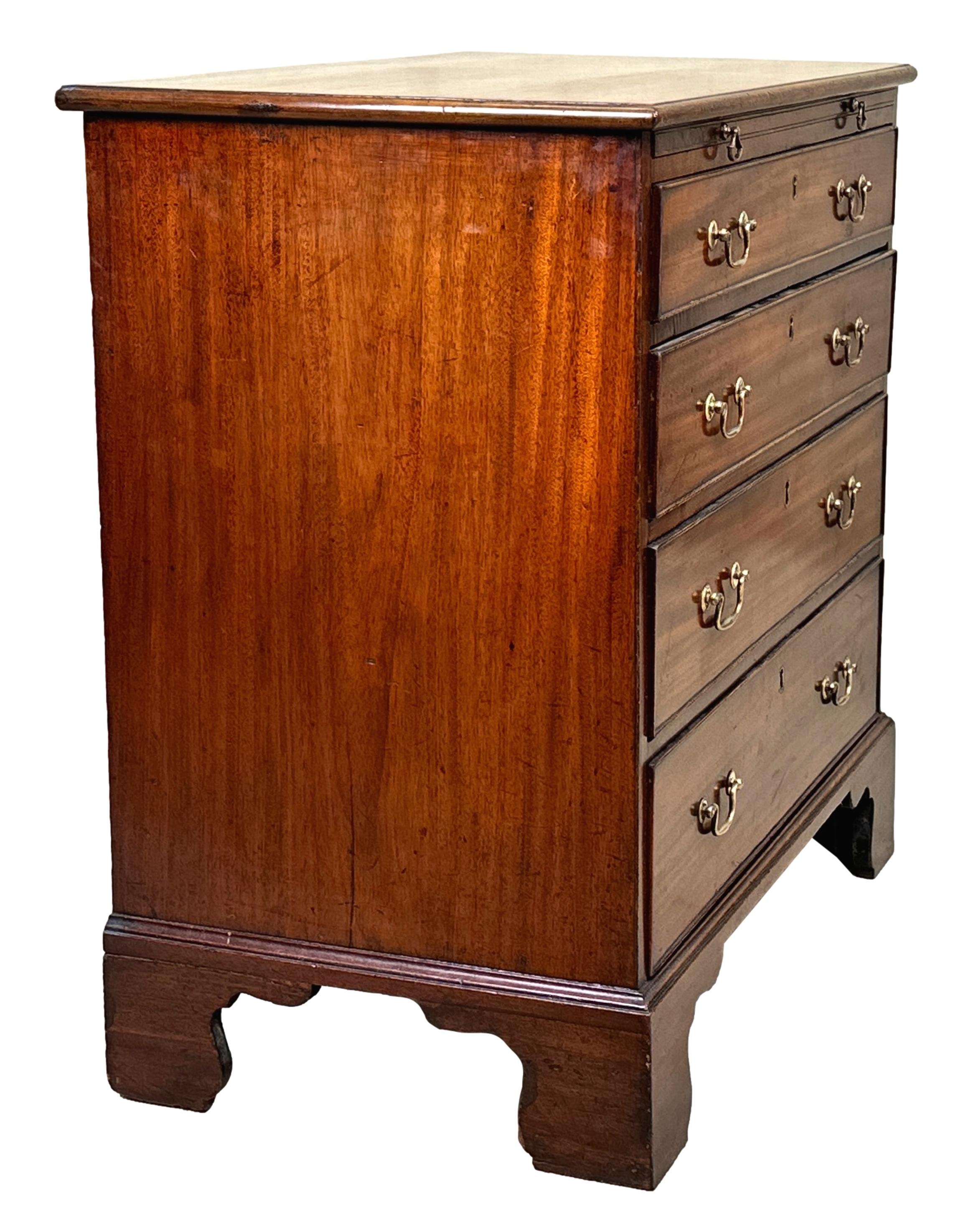 A Very Good Quality 18th Century Georgian Mahogany Chest Of Small Proportion Retaining Good Colour And Patina Throughout, The Well Figured Top Over Brushing Slide And Four Graduated Long Drawers Retaining Original Brass Swan Neck Handles Raised On