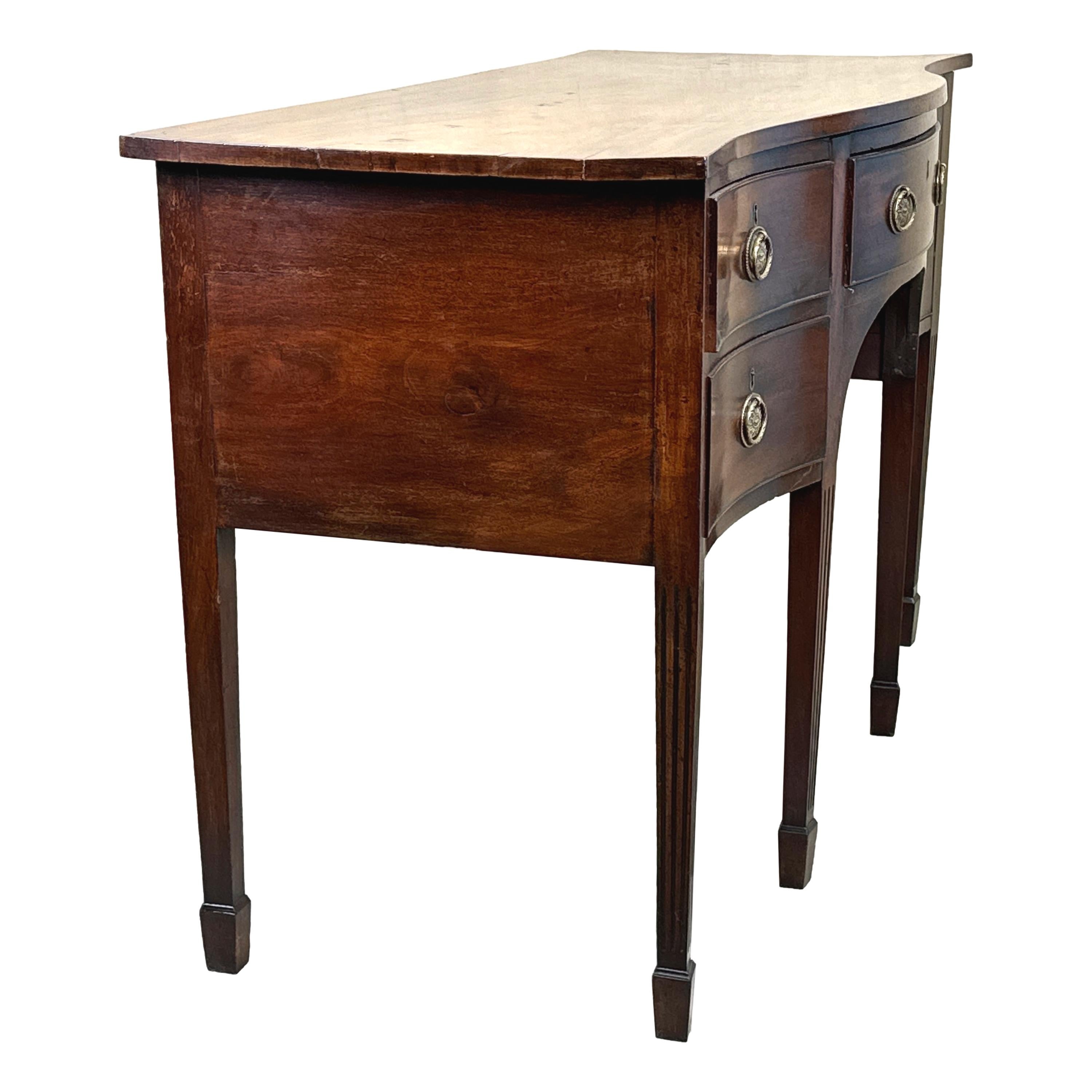 A Very Good Quality Late 18th Century, Georgian, mahogany Hepplewhite Period Serpentine Sideboard, Of Unusual Diminutive Proportions, Retaining Exceptional Colour And Patina Throughout, With Well Figured Top Over Four Drawers, Including One With