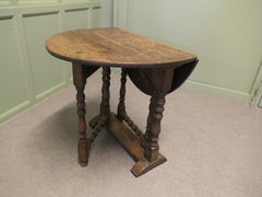 Small Georgian Oak Gate Leg Table The table has a solid oak top with turned leg
