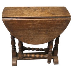 Small Georgian Oak Gate Leg Table The table has a solid oak top with turned leg
