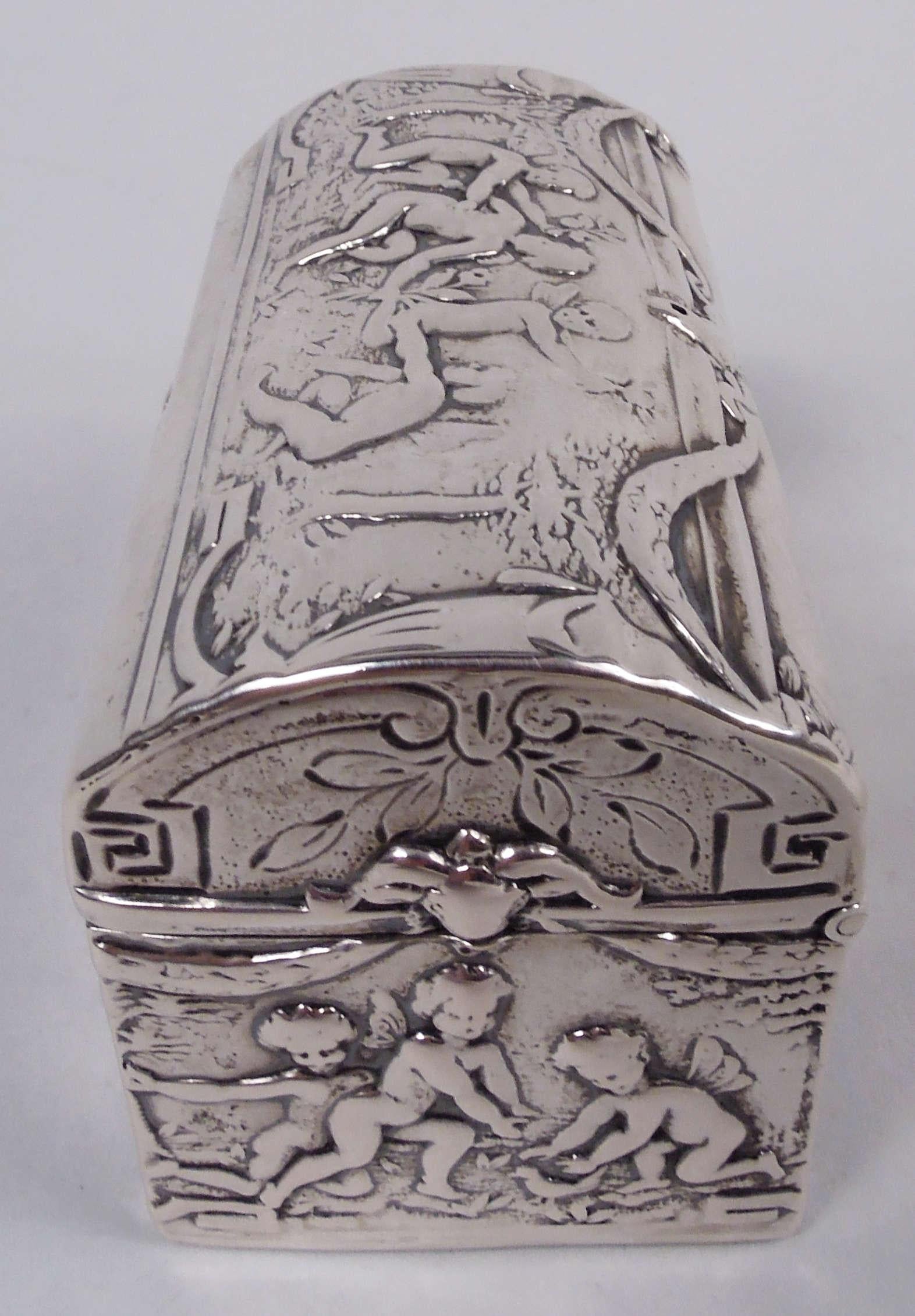German Rococo 800 silver casket, ca 1900. Rectangular with straight sides and sharp corners. Cover hinged with curved top. Chased scenes of frolicking cherubs in nature. Hanau marks. Weight: 1.8 troy ounces. 