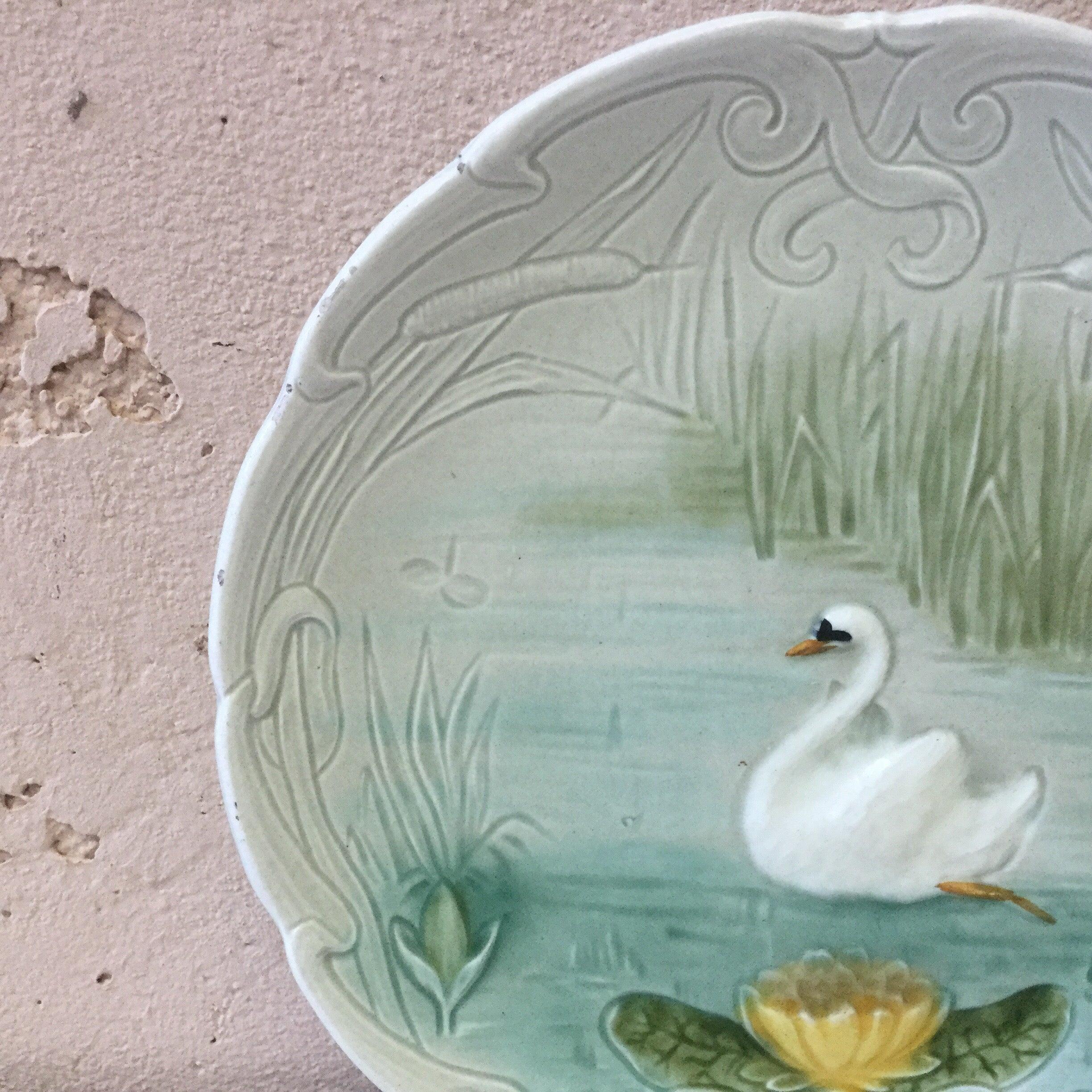 Small German Majolica swan with a water lily plate, circa 1900.