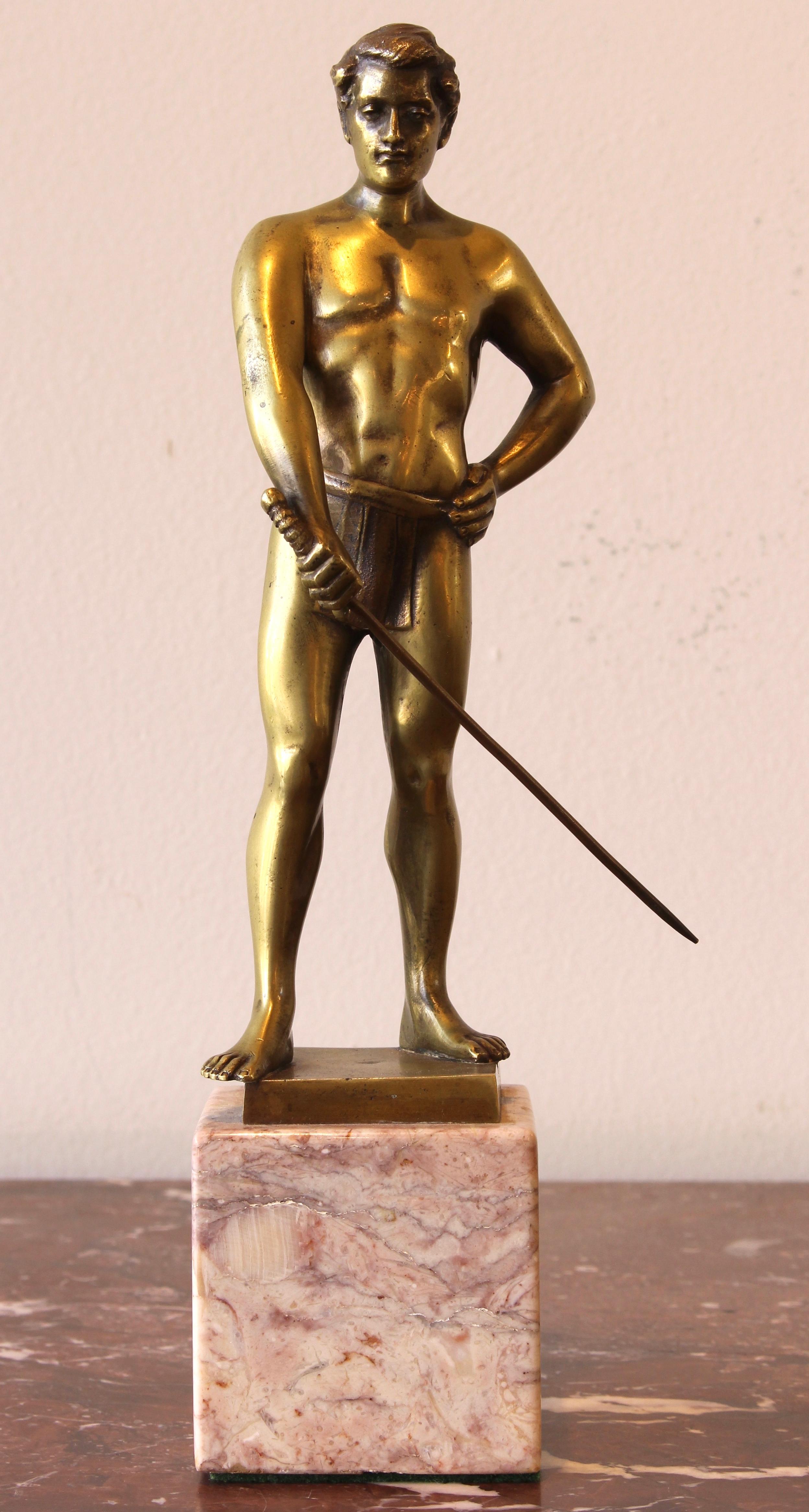 A small cast bronze sculpture of a fencer by Franz Iffland, 1862-1935, on rose marble base.
