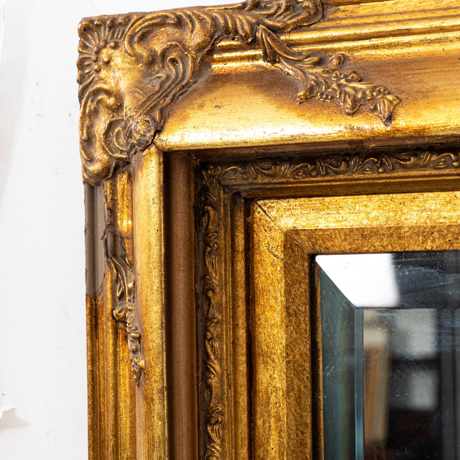 Small gilt Italian mirror with beveled edge, please note of wear consistent with age.