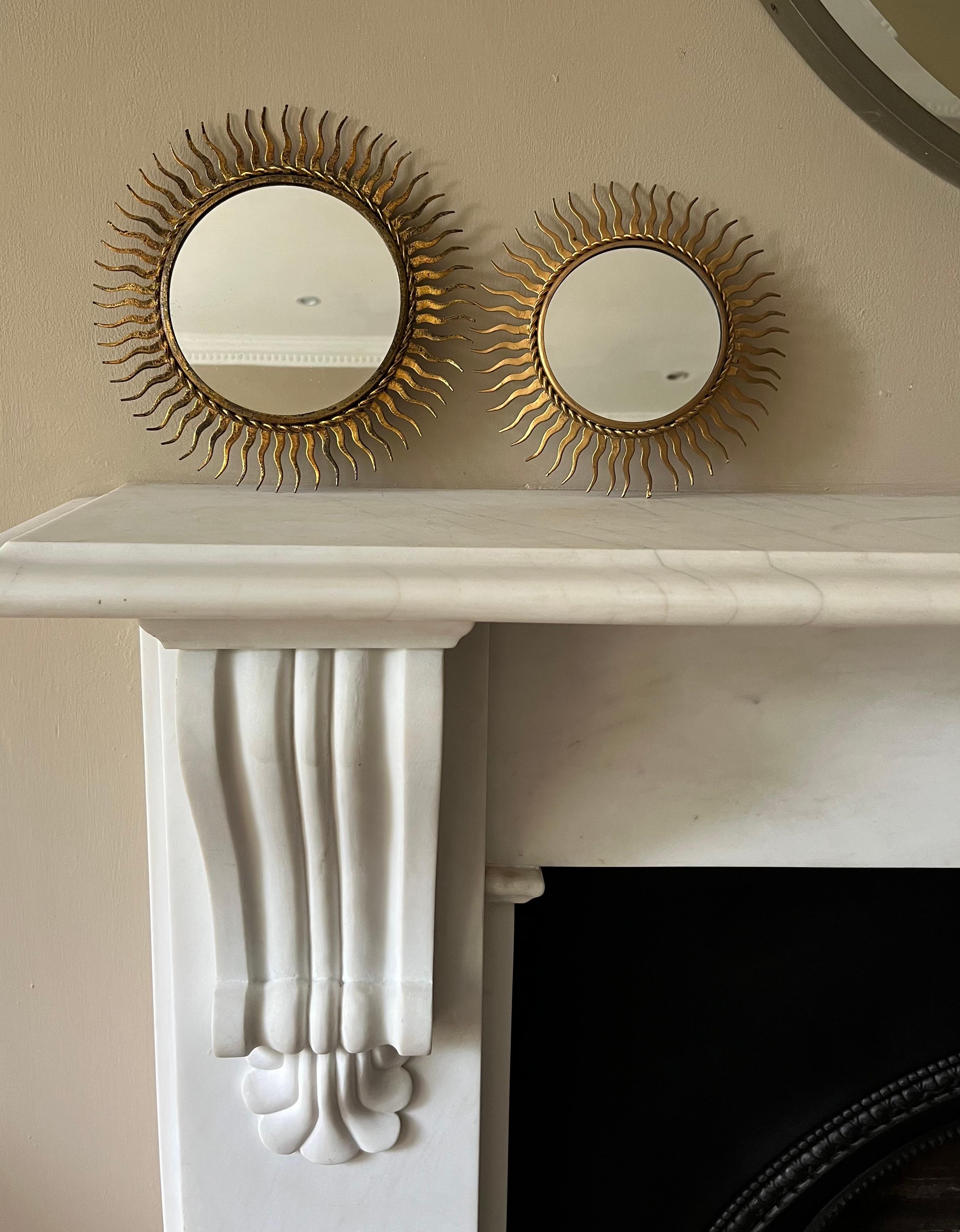 A midcentury small gilded metal sunburst mirror. Spanish.