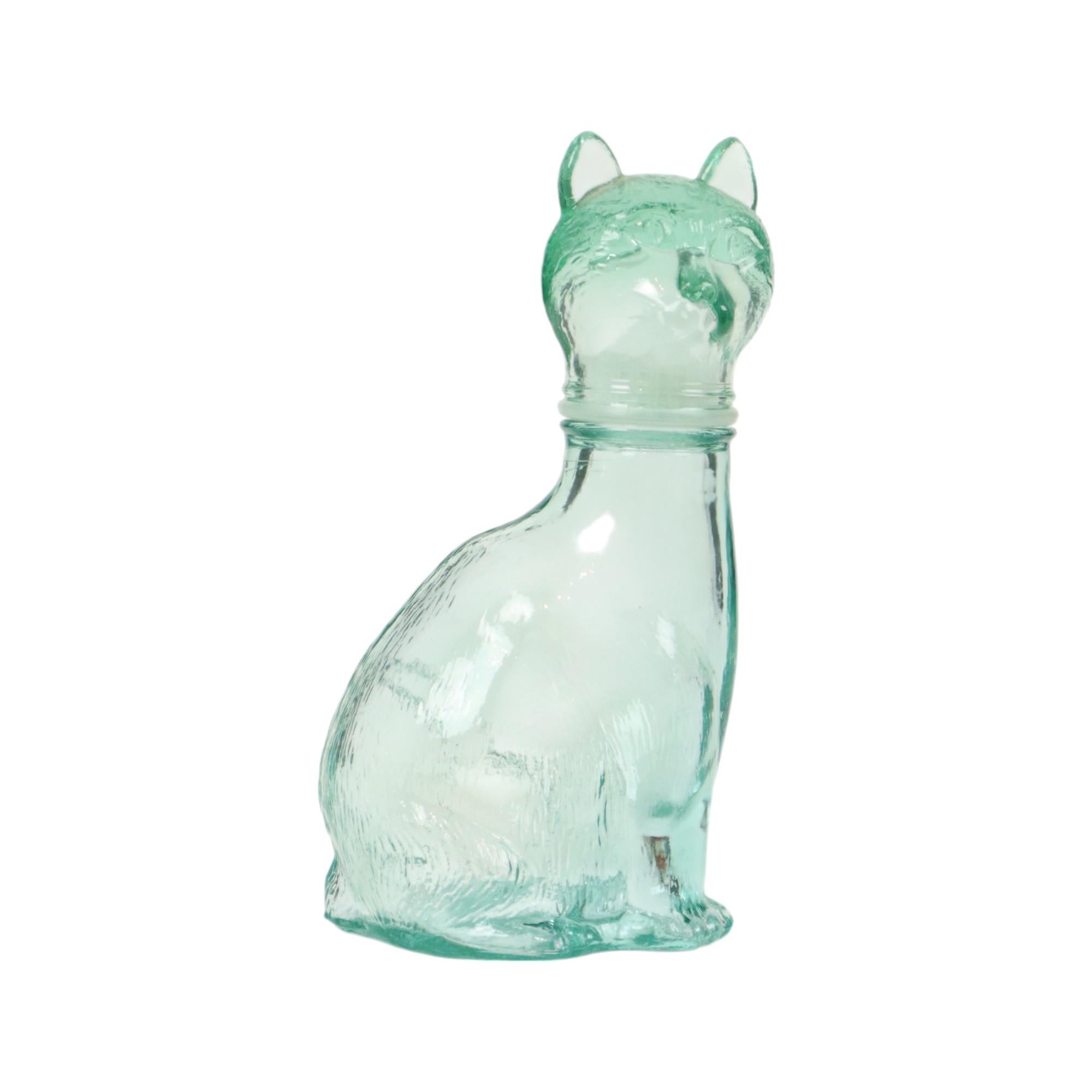 Vintage glass cat carafe, light blue liqueur bottle in the shape of a cat, made by Vetreria Etrusca, Italian glassware, circa 1960s.

Decorative object, can still be used to store liqueur, but can also hold its own as a figurine on the