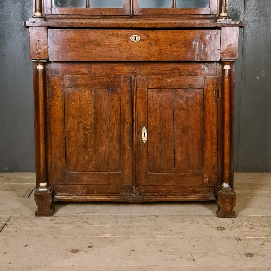 Small and unusual glazed oak display cupboard. Very good colour, 1830.

Dimensions:
42 inches (107 cms) wide
18.5 inches (47 cms) deep
82 inches (208 cms) high.