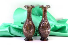 Small glazed porcelain vases with silver floral applications