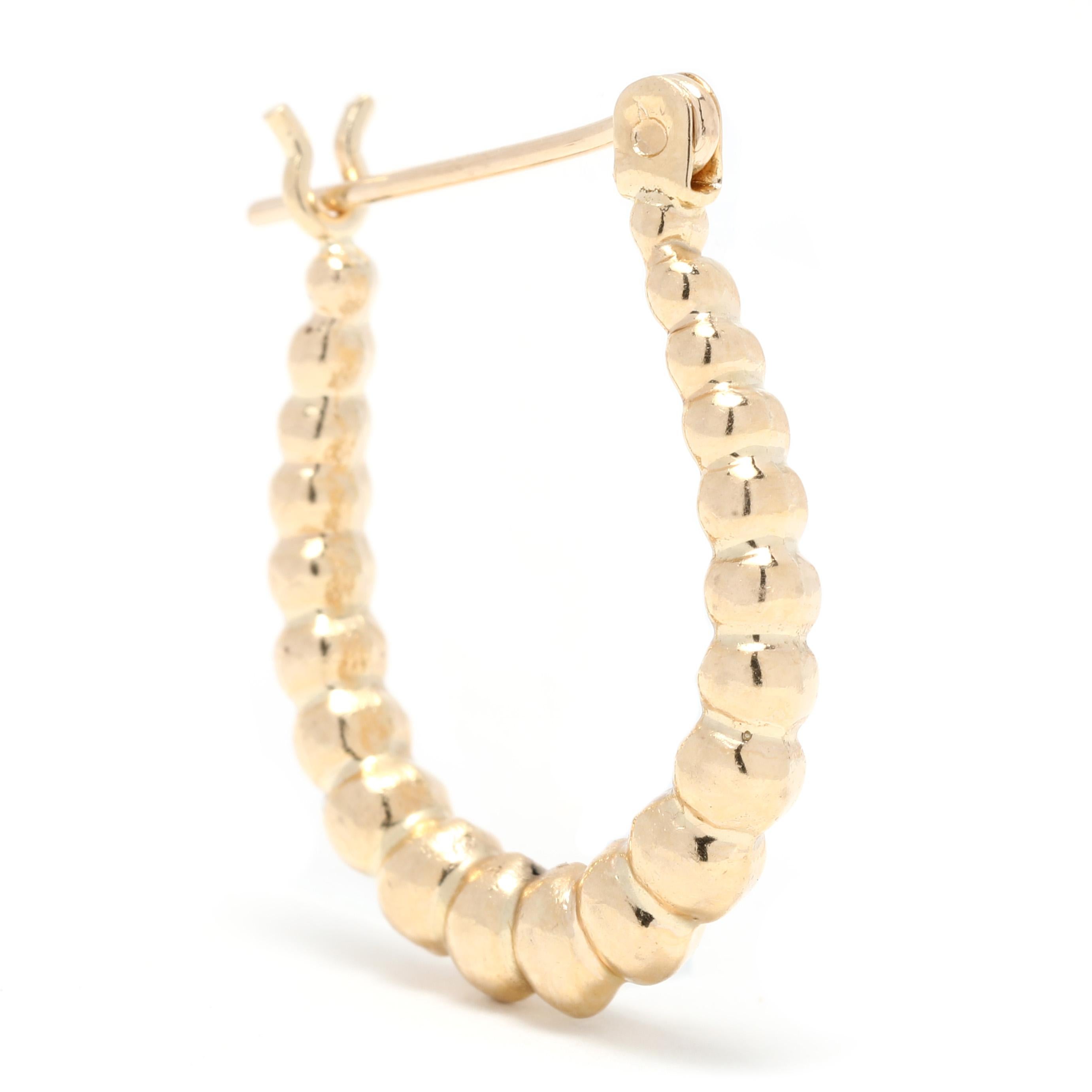 These small gold bubble hoop earrings are a perfect everyday accessory. Crafted in 14K yellow gold and measuring 3/4 inch in length, these fancy gold hoops are lightweight and comfortable to wear. A great addition to your jewelry collection, these