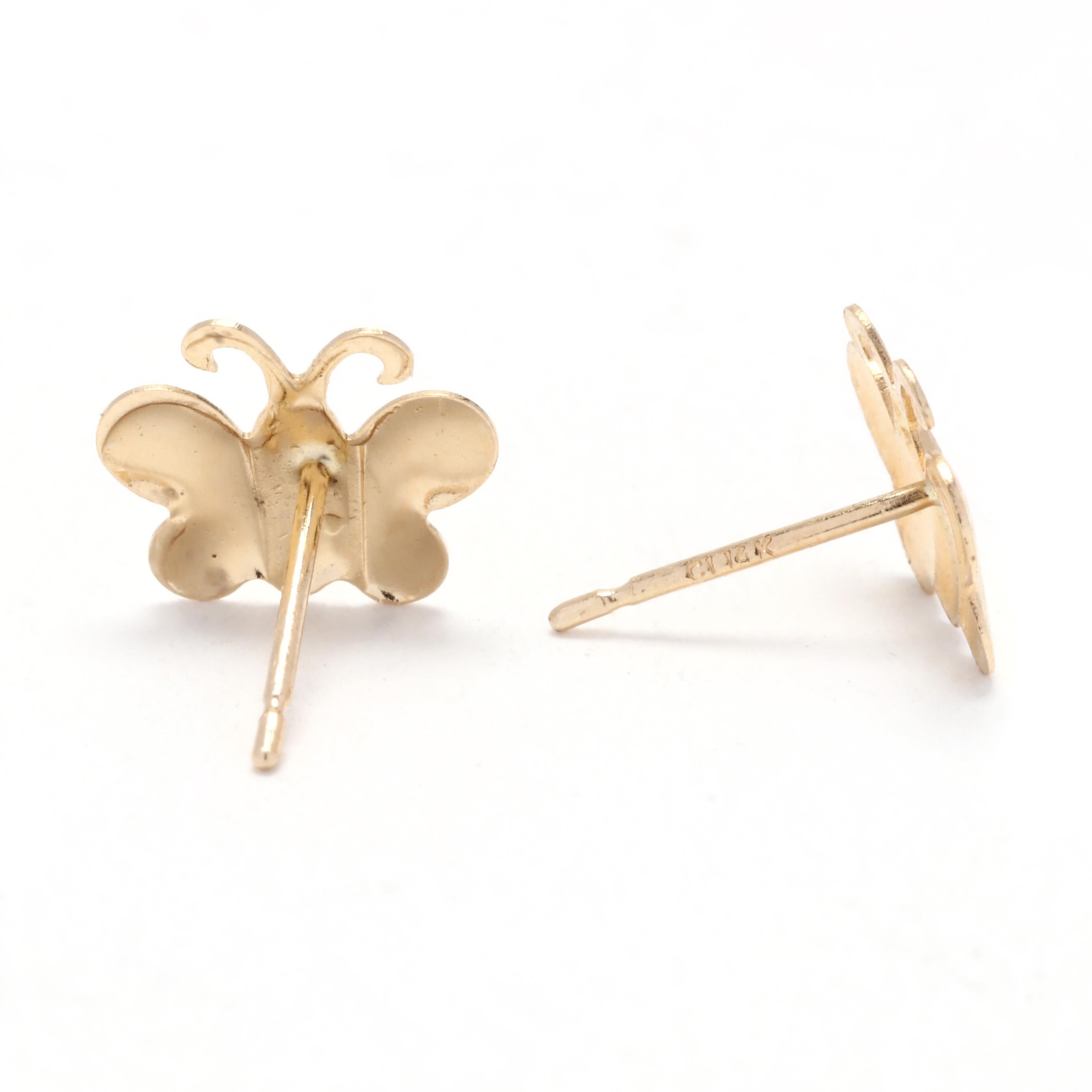 Add a touch of timeless elegance to your look with these small gold butterfly stud earrings. Made from 14K yellow gold, these earrings feature a delicate butterfly design that adds a whimsical charm to your ensemble. With a length of 1/4 inch, these