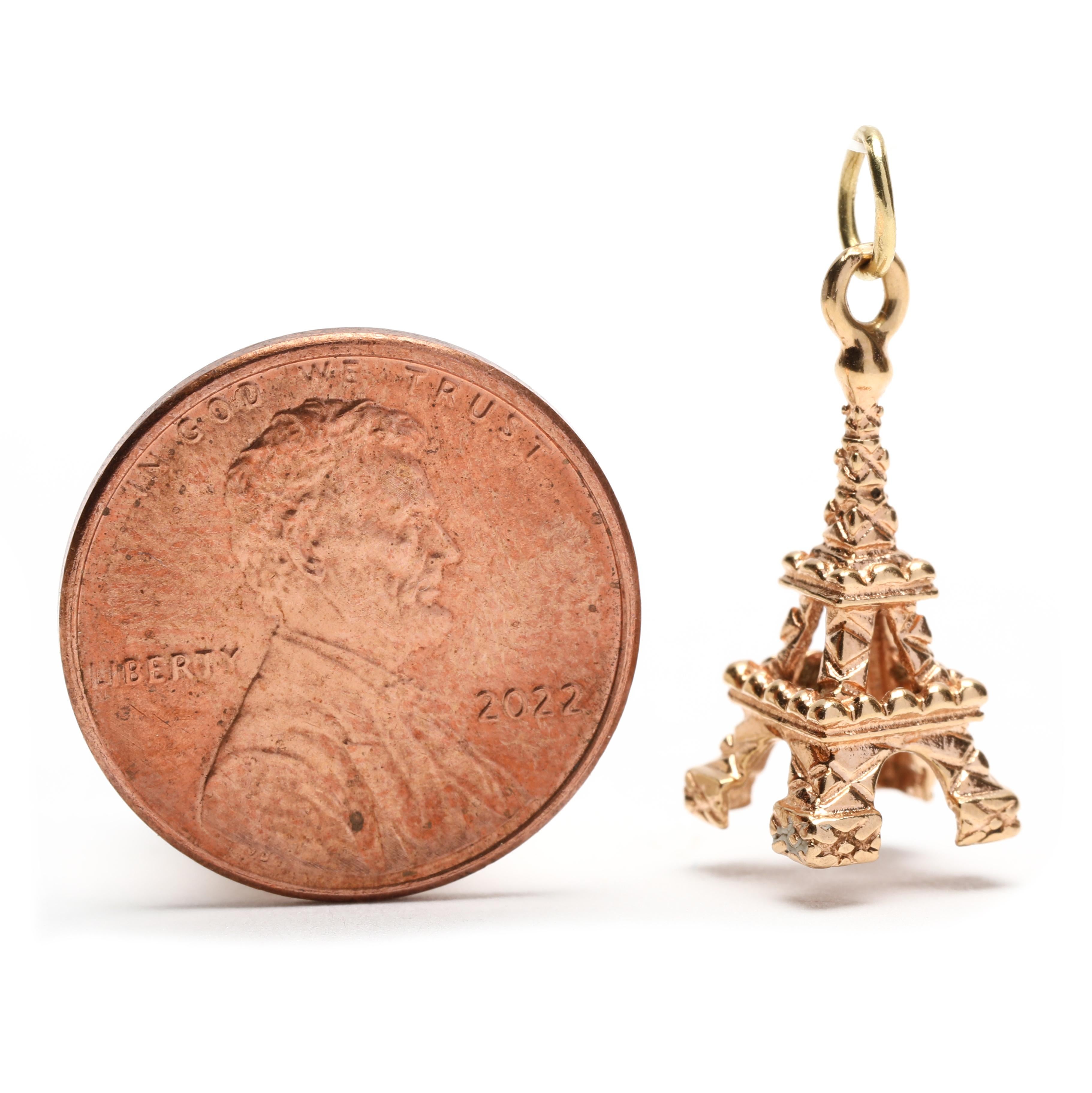 This small gold Eiffel Tower charm is a beautiful and delicate piece of jewelry that will make a great addition to your collection. Crafted from 18K yellow gold, this charming Paris-inspired charm measures 7/8 inch in length and makes a perfect gift