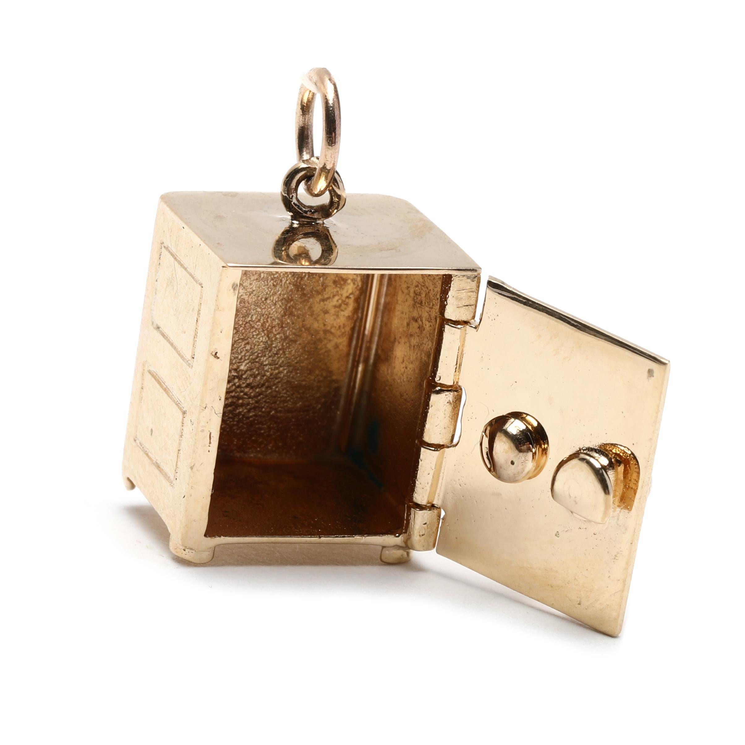 This 14K Yellow Gold Small Gold Safe Charm is the perfect addition for any jewelry collection. This charming safe charm is 3/4 inch in length and features a working safe with an articulated lid. Crafted from 14K yellow gold, it is sure to add a