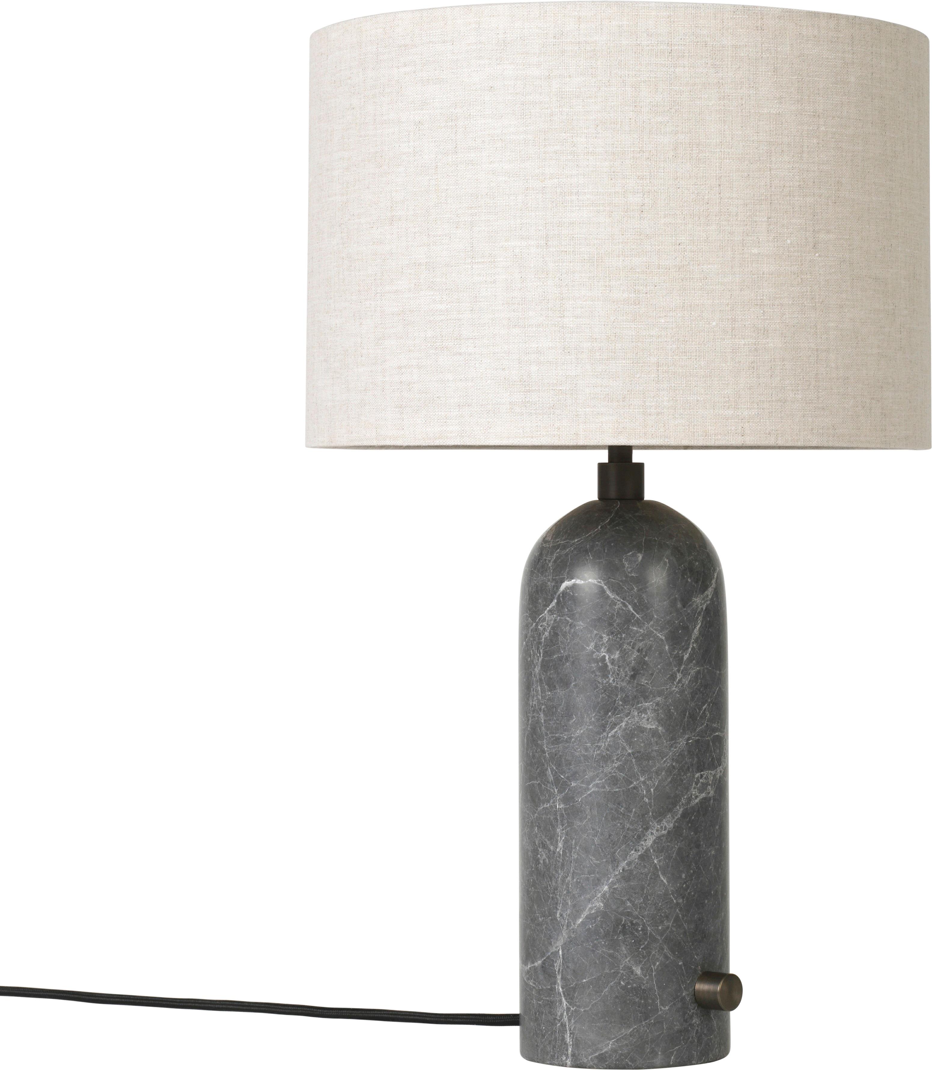 Small 'Gravity' marble table lamp by Space Copenhagen for Gubi in grey.

Executed in solid marble with a canvas or white textile shade perched atop its stem, the Gravity table lamp designed by Space Copenhagen for GUBI contrasts strength and
