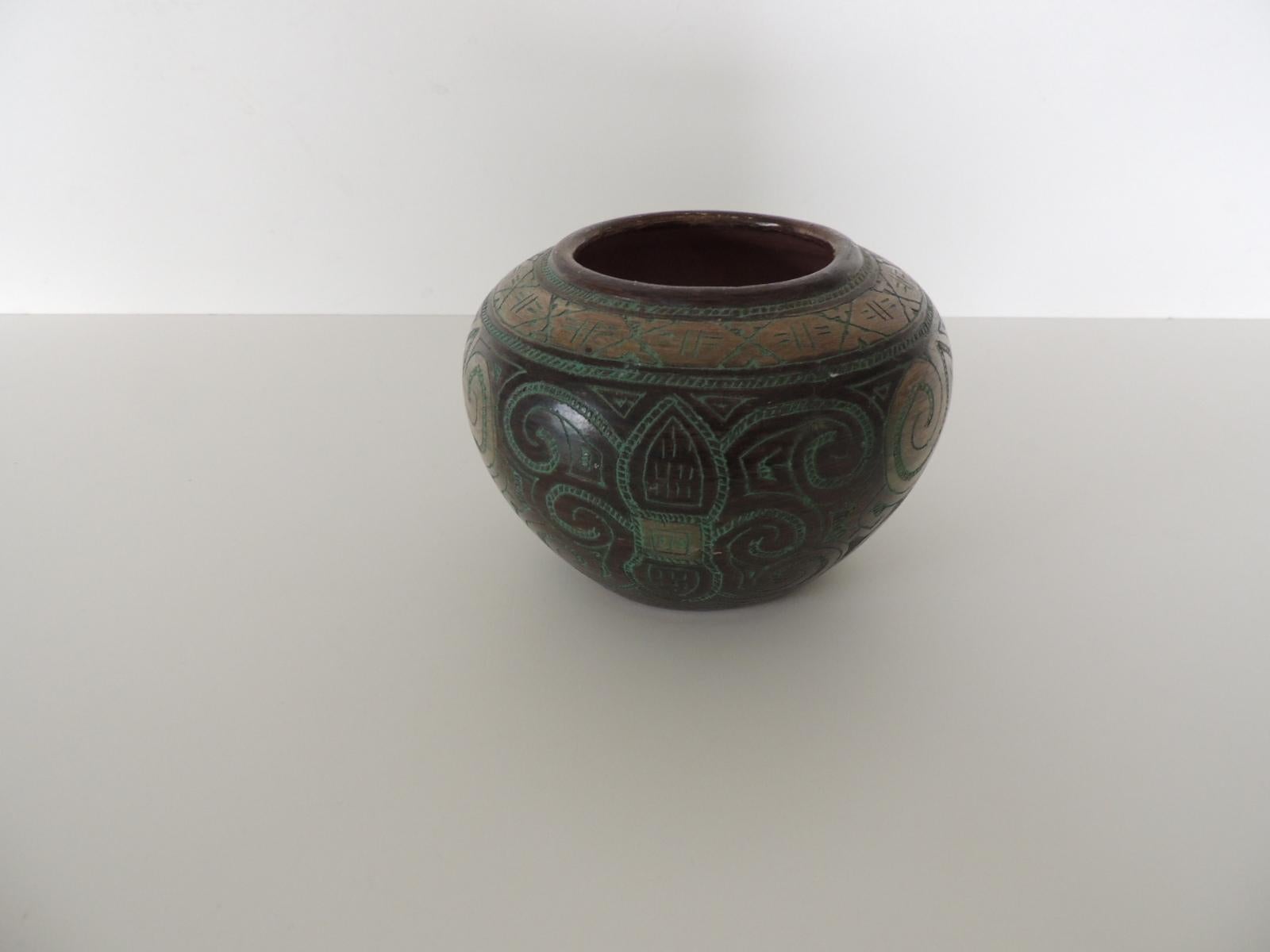 Small green and black vase.
Tribal patterns hand carved into terracotta.
Size: 6