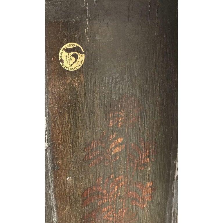 A small early Georgian dark green japanned (‘lacquer’) chinoiserie longcase clock. 
George II period, circa 1740.
Retaining its lovely original 18th century decoration.
With its original antique and highly sought-after period brass-bound