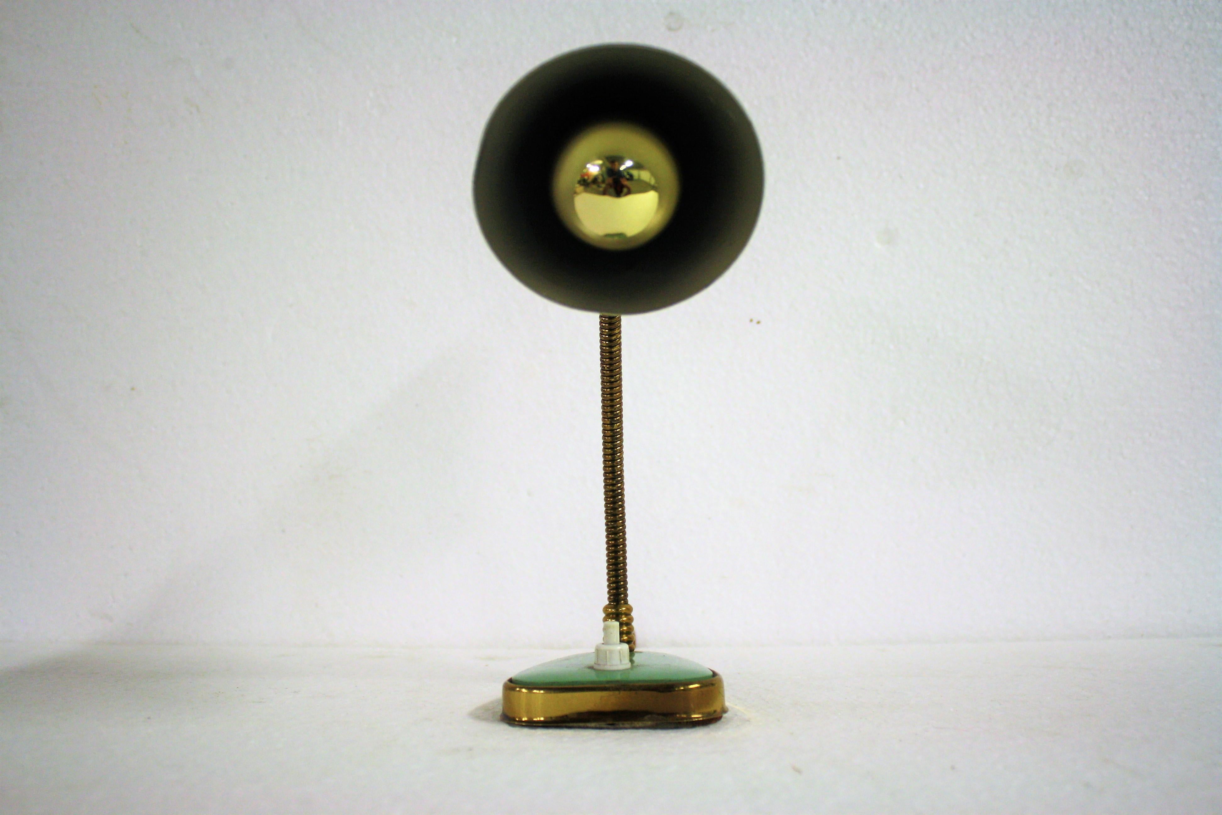 Charming Mid-Century Modern table lamp manufactured by Palma Firenze - Italy

It consists of a fine aluminum lampshade mounted on a flexible brass arm.

The base has a brass finish as well.

The lamp is in a beautiful used condition.

This