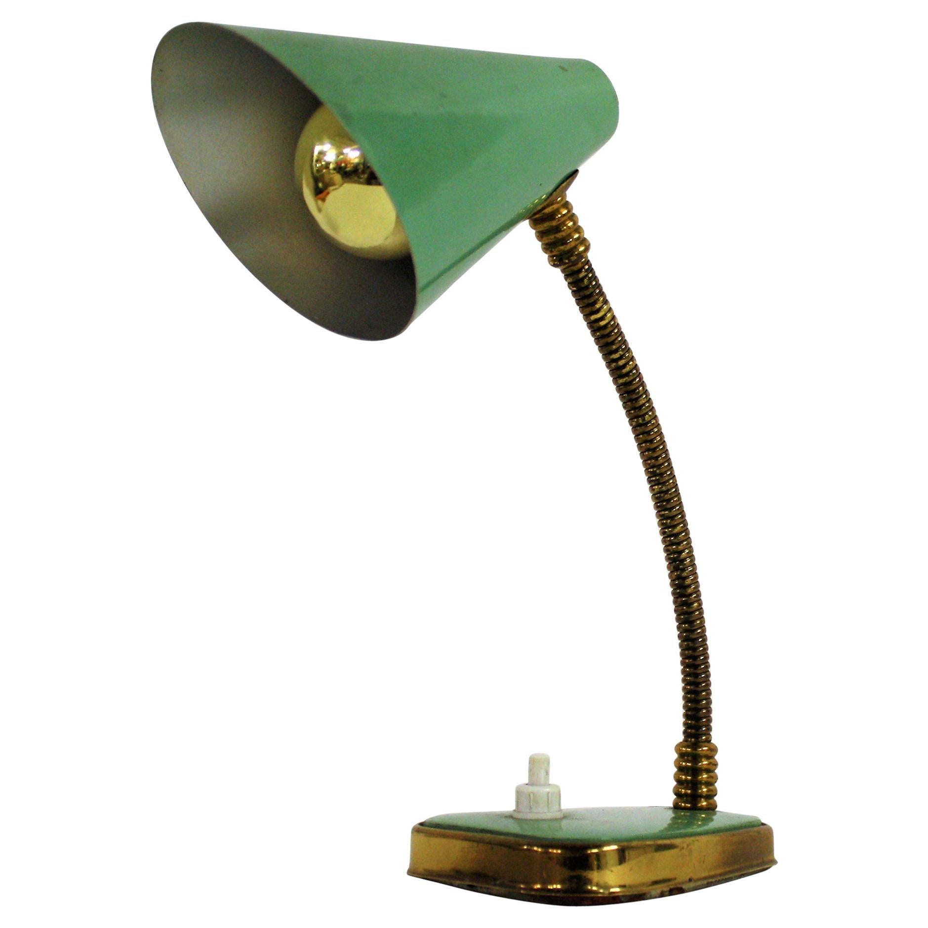 Charming Mid-Century Modern table lamp manufactured by Palma Firenze - Italy

It consists of a fine aluminum lampshade mounted on a flexible brass arm.

The base has a brass finish as well.

The lamp is in a beautiful used condition.

This