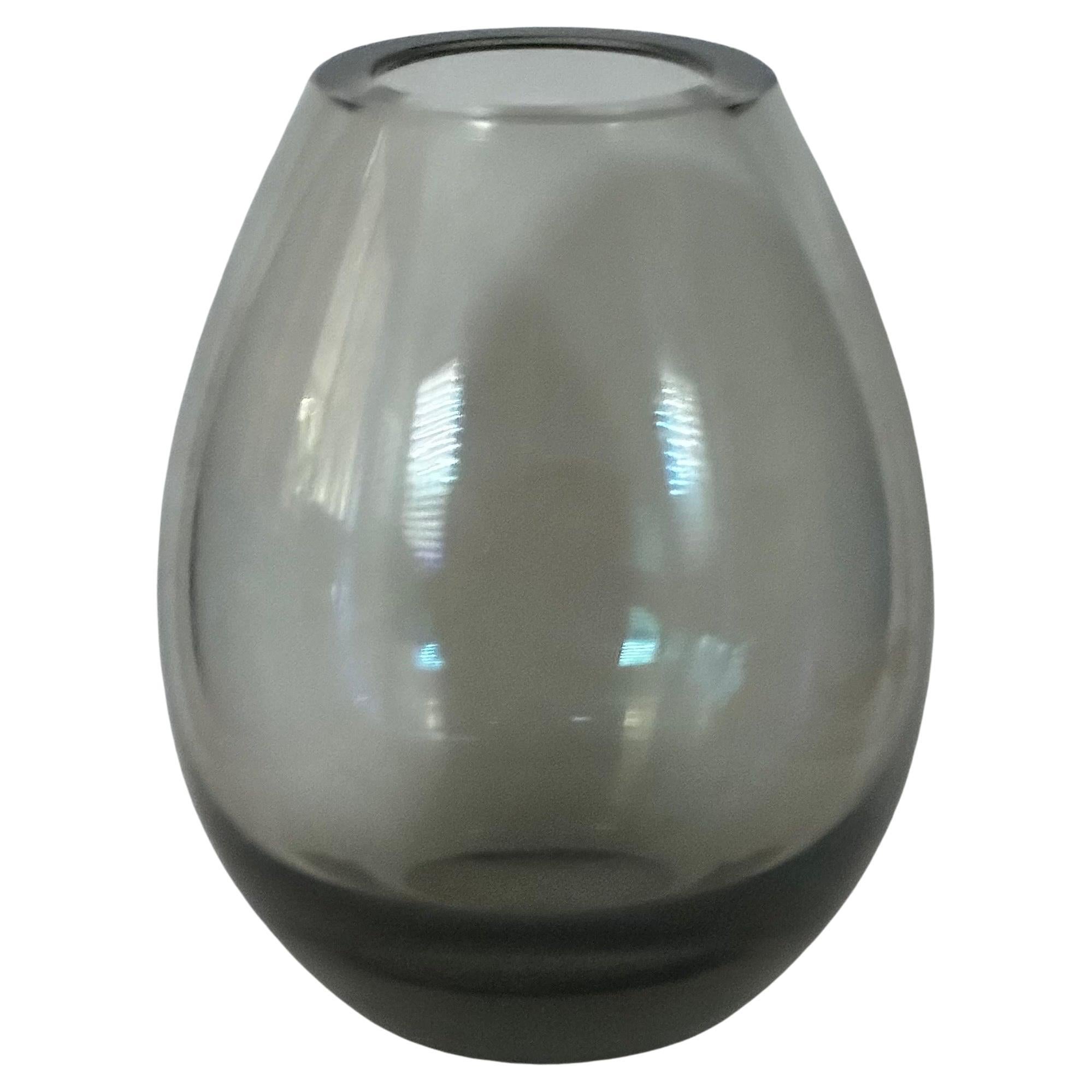 A very attractive small hand blown smoked glass vase by Per Lutken for Holmegaard, circa 1960s. The piece is in very good vintage condition with no chips or cracks (there are some minor scratches to the underside consistent with age and use) and
