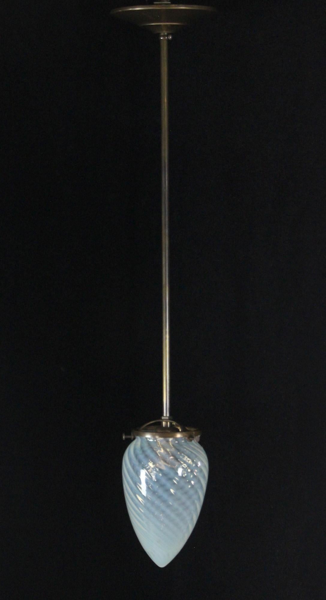 Small cone shaped opalescent glass globe featuring swirled details. Antique brass finish hardware with new wiring round out this pendant light. Please note, this item is located in our Scranton, PA location.