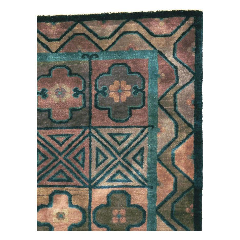 A small antique Chinese Art Deco accent rug from the early 20th century with a neutral earth tone palette including shades of blue, green, and purple.
