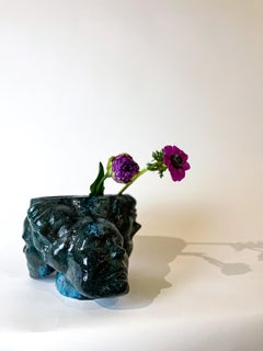 Small handmade ceramic vase or flower pot in turquoise-black in stock