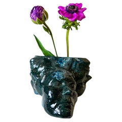 Small handmade ceramic vase or flower pot in turquoise-black in stock