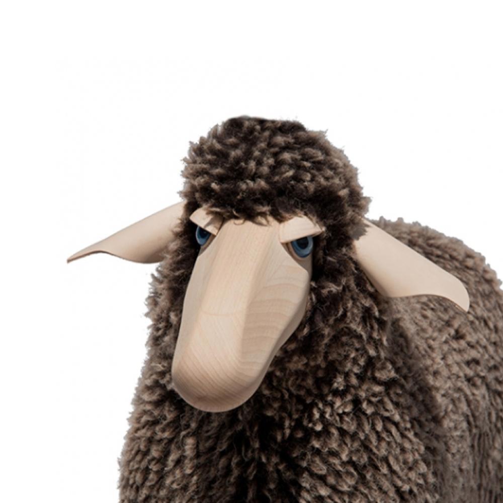 Small sheep in brown wool plush and handmade beech wood. Designed by German artist and designer Hans-Peter Krafft, produced in Germany by Meier Germany. 

Originally used as a stool, the sheep is also a beautiful sculptural object. 

Materials: