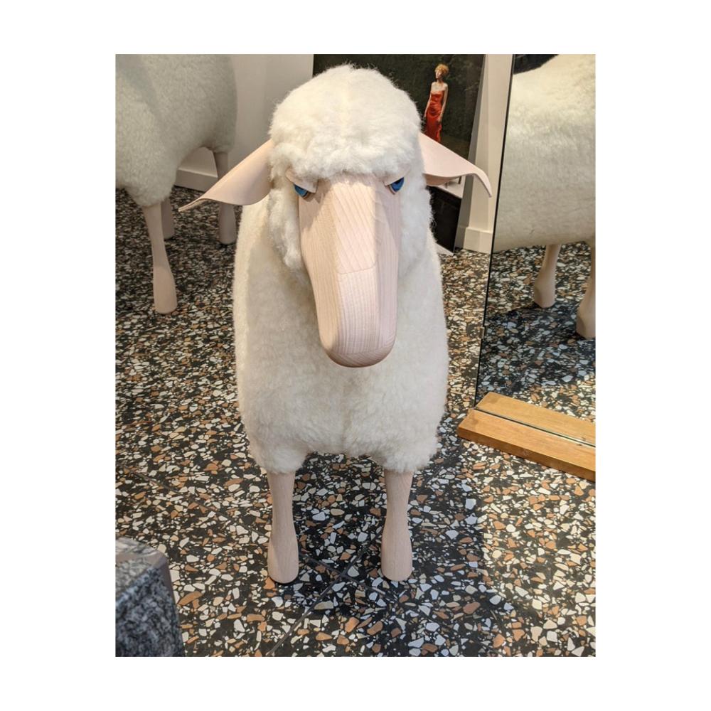 Small handmade sheep in white wool plush and beech wood. Designed by German artist and designer Hans-Peter Krafft, produced in Germany by Meier Germany. 

Originally used as a stool, the sheep is also a beautiful sculptural object. 

Materials I