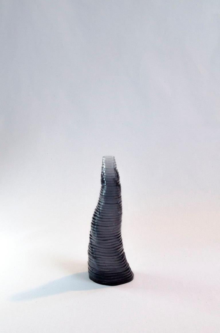 Small Handmade Stratum Tempus Anthracite Acrylic Vase by Daan De Wit
Numbered Edition
Dimensions: D 5 x H 15 cm.
Materials: Acrylic.
Also available in other sizes and colors.

Inspired by flowers, made for flowers.
Each piece is spirally