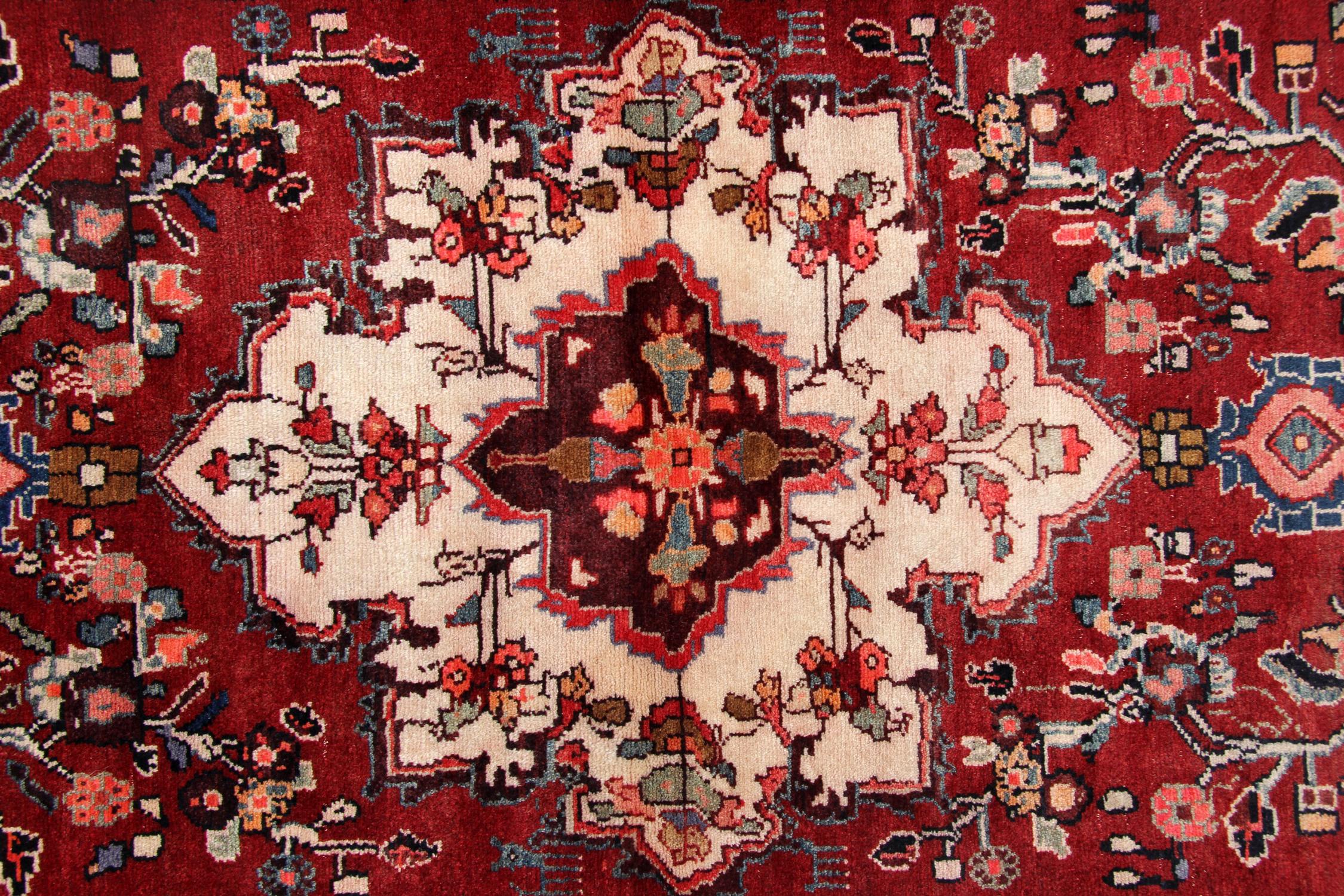 Both the colour, design and construction of this fine wool rug make it the perfect accent piece. Woven with a rich red background with a fantastic floral design, symmetrically woven with blue, pink, orange and white accent colours. This is then
