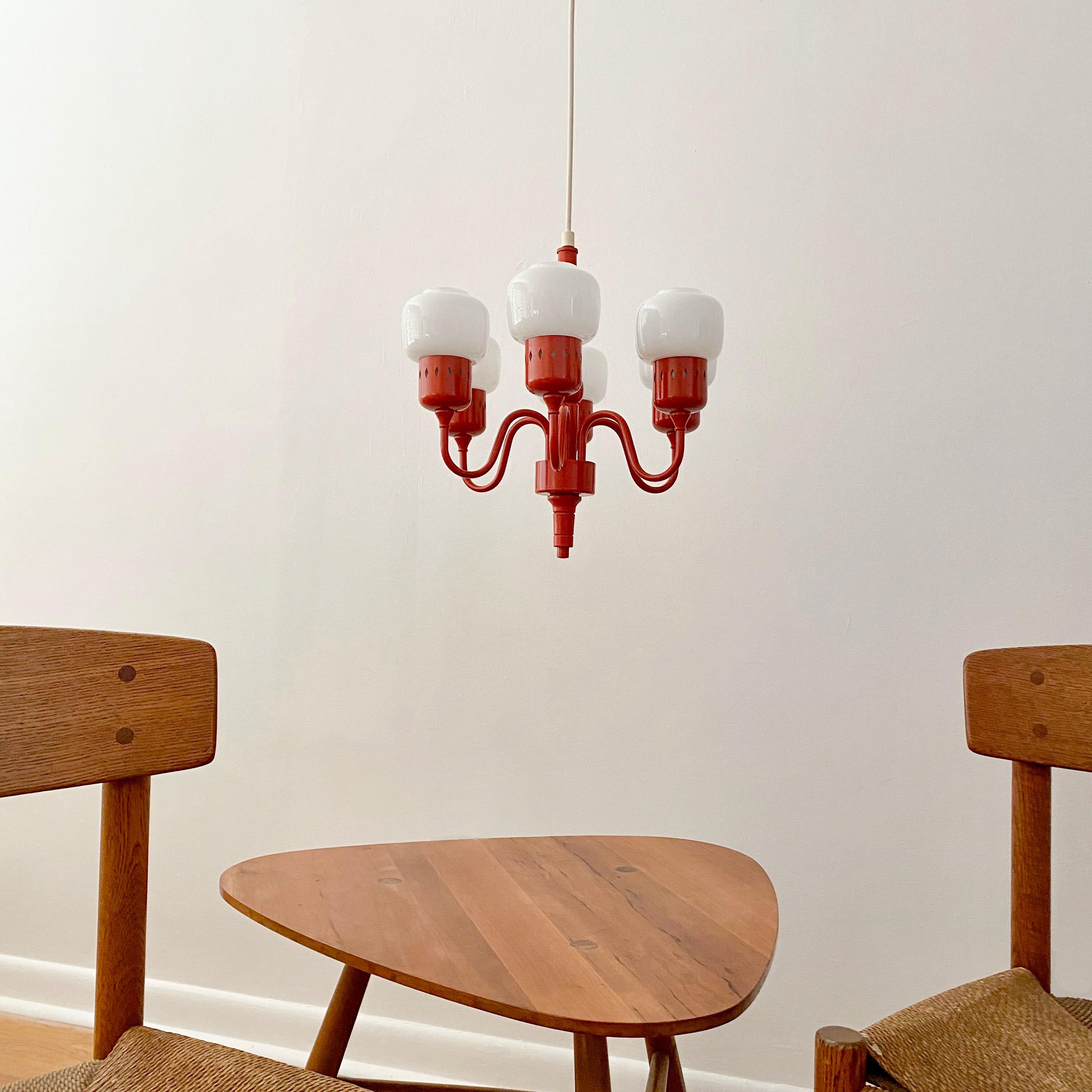 A small chandelier designed by Hans - Agne Jakobsson for his company Hans - Agne Jakobsson AB in Markaryd, Sweden. The chandelier was designed in 1964, called the 