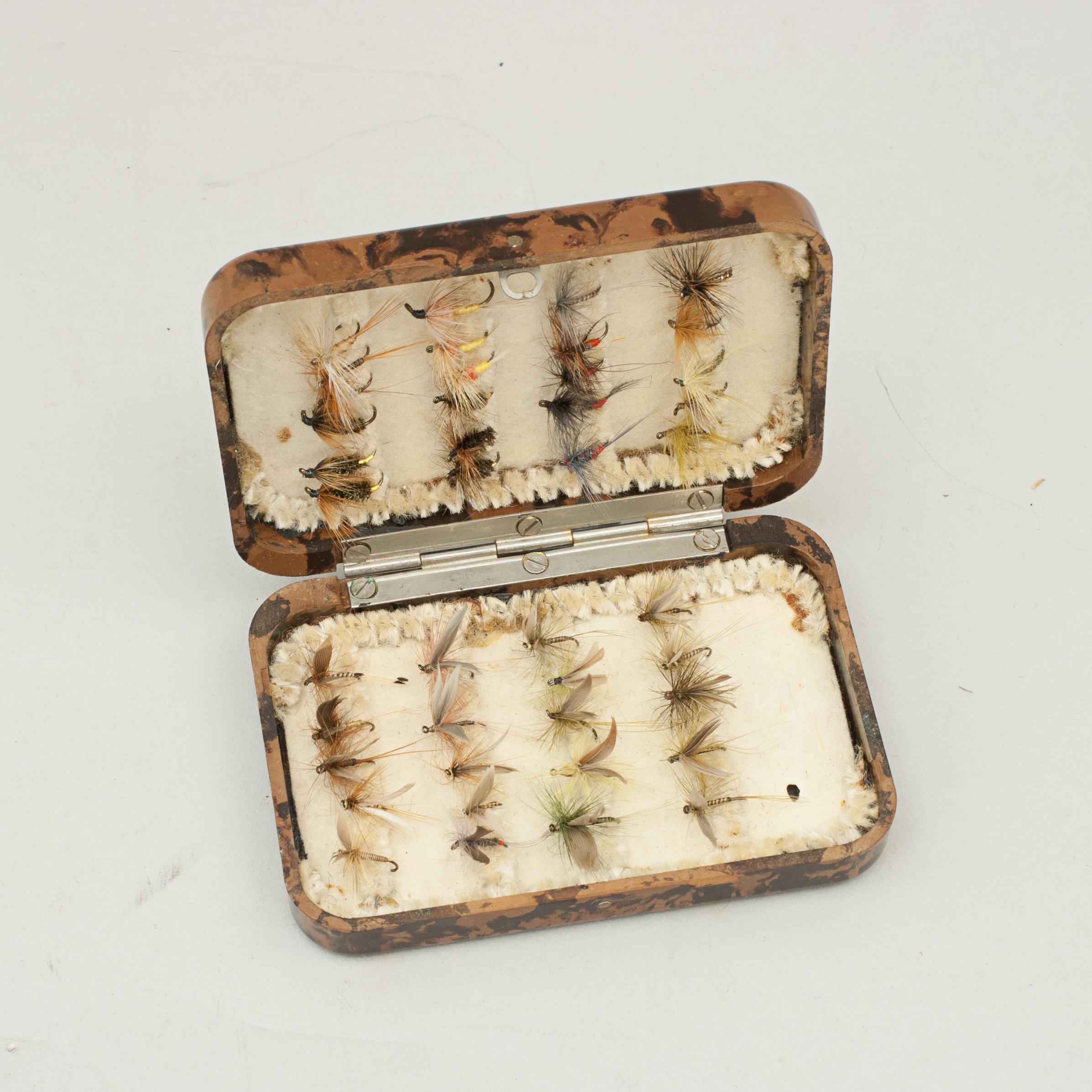 Vintage small Hardy Bros. NerodafFfishing fly box
A good Neroda fly box made from bakelite with a brown tortoiseshell finish manufactured by Hardy's of Alnwick. The lid is embossed with 'HARDY BROS. MAKERS ENGLAND' and holding a small selection of