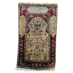 Alfombra de seda Hereke pequeña