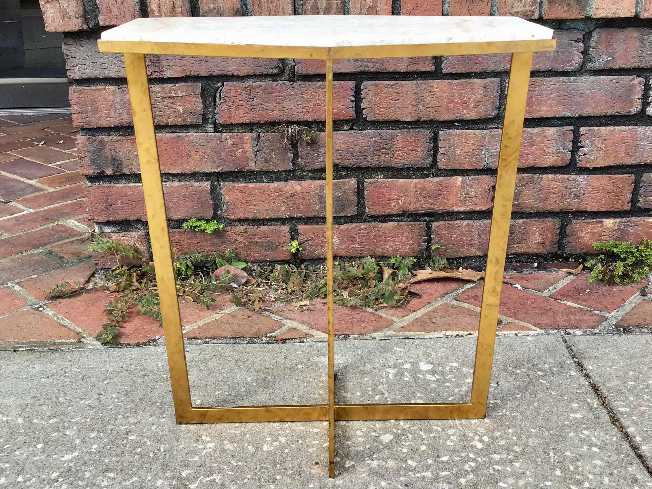 Very small hexagonal cocktail table with metal in gold base and travertine marble top for one or two drinks. Great addition to your glam decor bar and house.