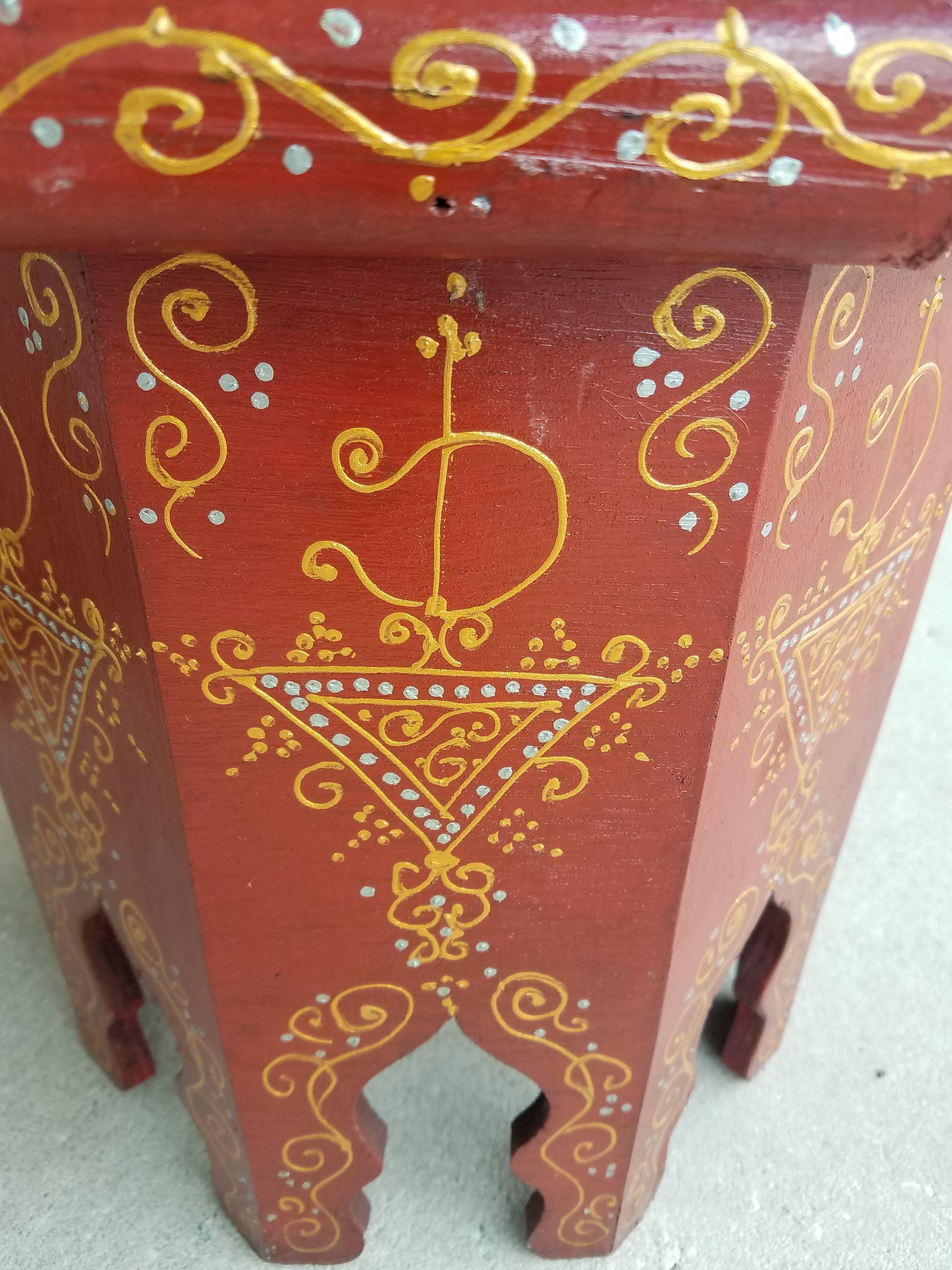 Rare find! 100% hand-painted Moroccan hexagonal shape side table. Red base with gold color design. Great handcraftsmanship throughout. Beautiful add-on to your decor. This table measures approximately 14