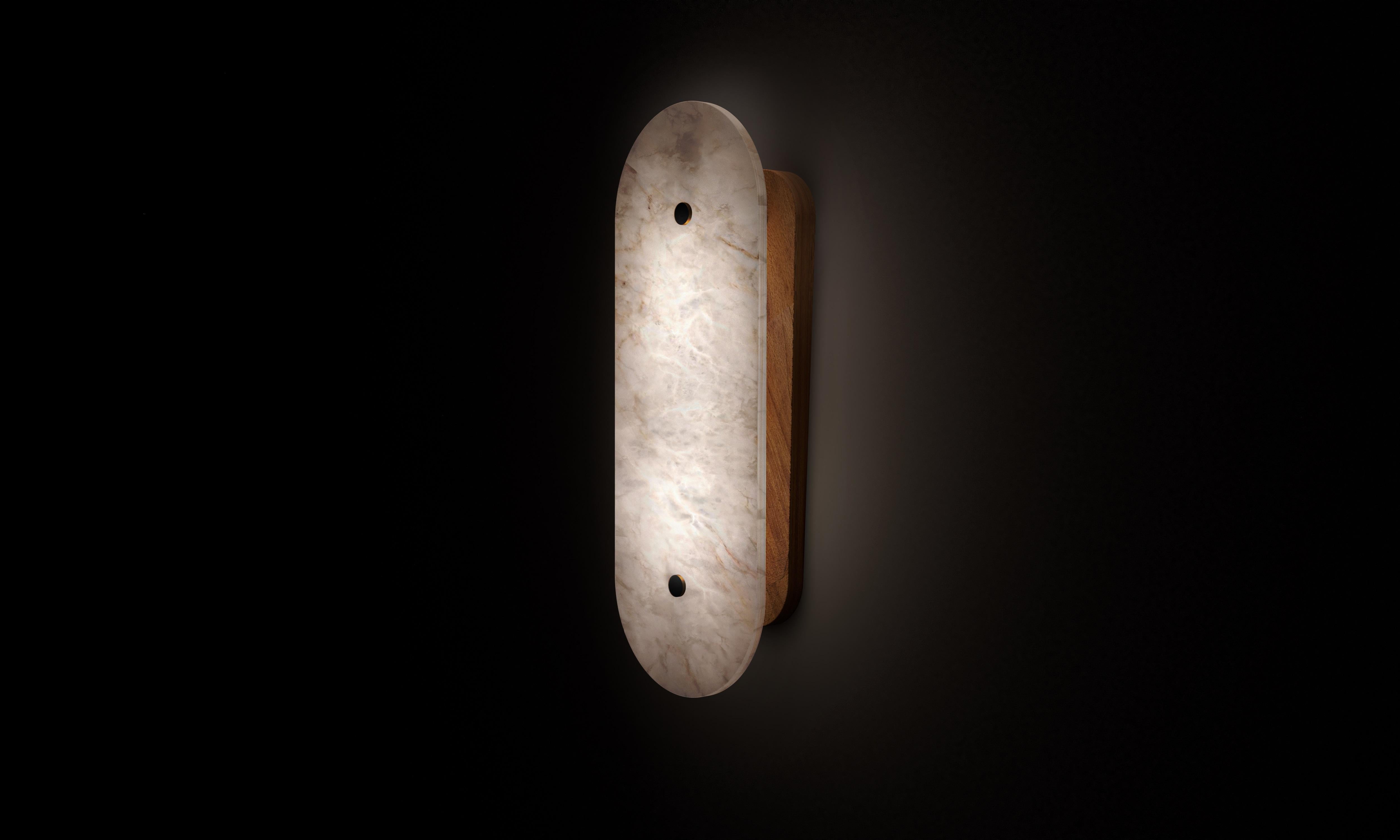 Small Hikari Wall Lamp by Alabastro Italiano
Dimensions: D 9.3 x W 15 x H 40 cm.
Materials: White alabaster, Iroko wood.
Available in other finishes and sizes.

All our lamps can be wired according to each country. If sold to the USA it will be