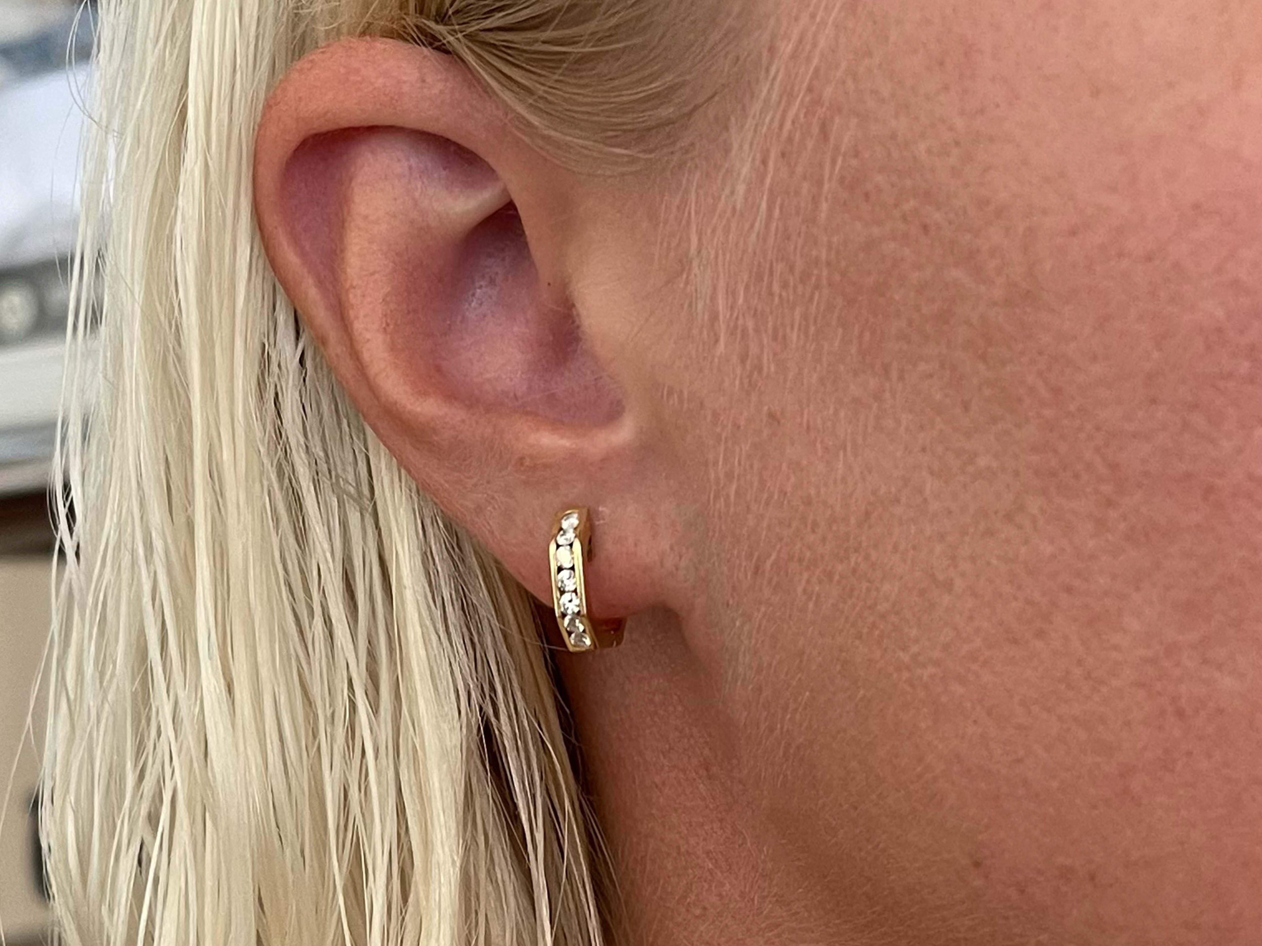 Earrings Specifications:

Metal: 14k Yellow Gold

Earring Diameter: 13 mm

Total Weight: 6.2 Grams

Diamonds: 14

Setting: Channel

Diamond Color: G-H

Diamond Clarity: SI

Diamond Carat Weight: 0.25 carats

Condition: Preowned
