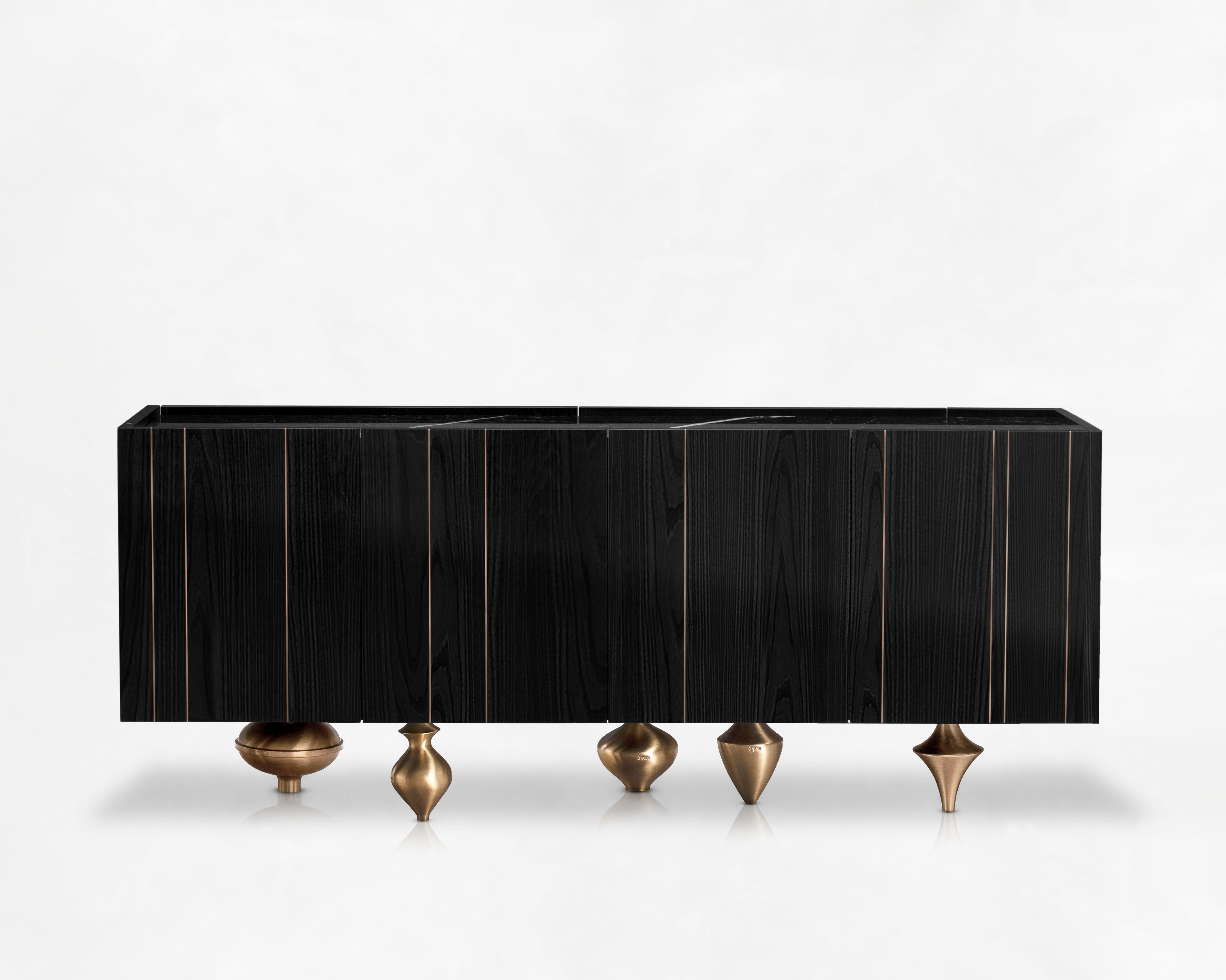 Small Il Pezzo 1 Black Credenza by Il Pezzo Mancante
Dimensions:  W 205 x D 83 x H 40 cm
Materials: Structure: black stained oak. Base: gold, satin brass, bronze, nickel. Top: black marquinia marble. 
Weight: approx 110 Kg

An alternation of rounded
