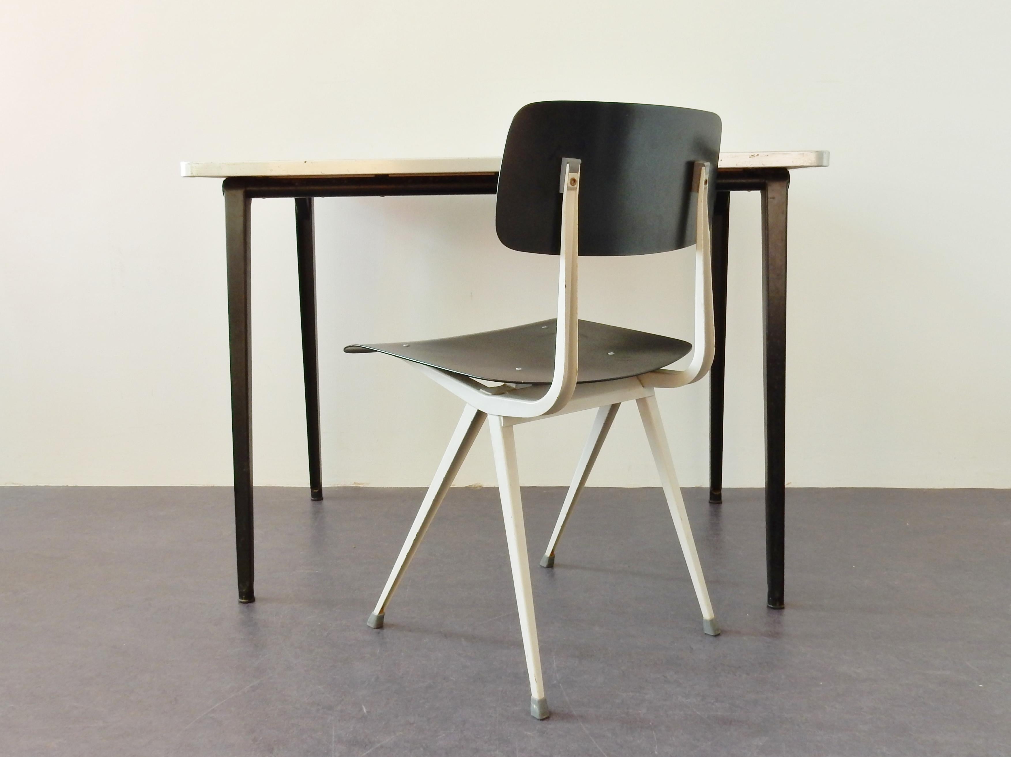 Set of a small, model reform, table desk with a, model result, chair by Friso Kramer for Ahrend de Cirkel. Table and chair are both in a very good, but visibly used and industrial condition. The table has the original and rare green linoleum top.