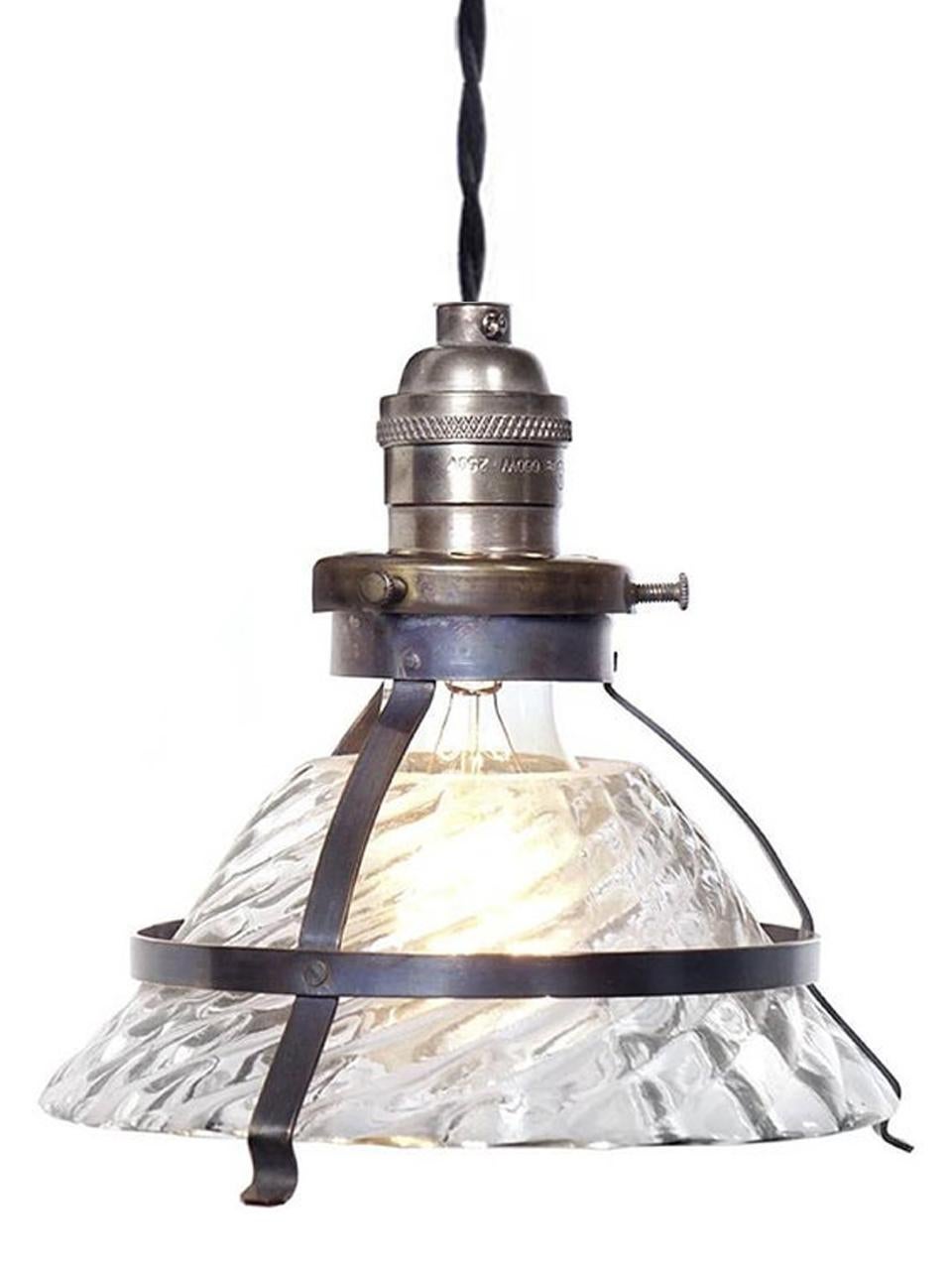 This is a unique industrial snap-in shade fixture. This shade was in the style of an early X-Ray lamp reflector. They have an elegant and complex industrial look with a 6.6 inch diameter and standard size brass socket. The combination of a clear