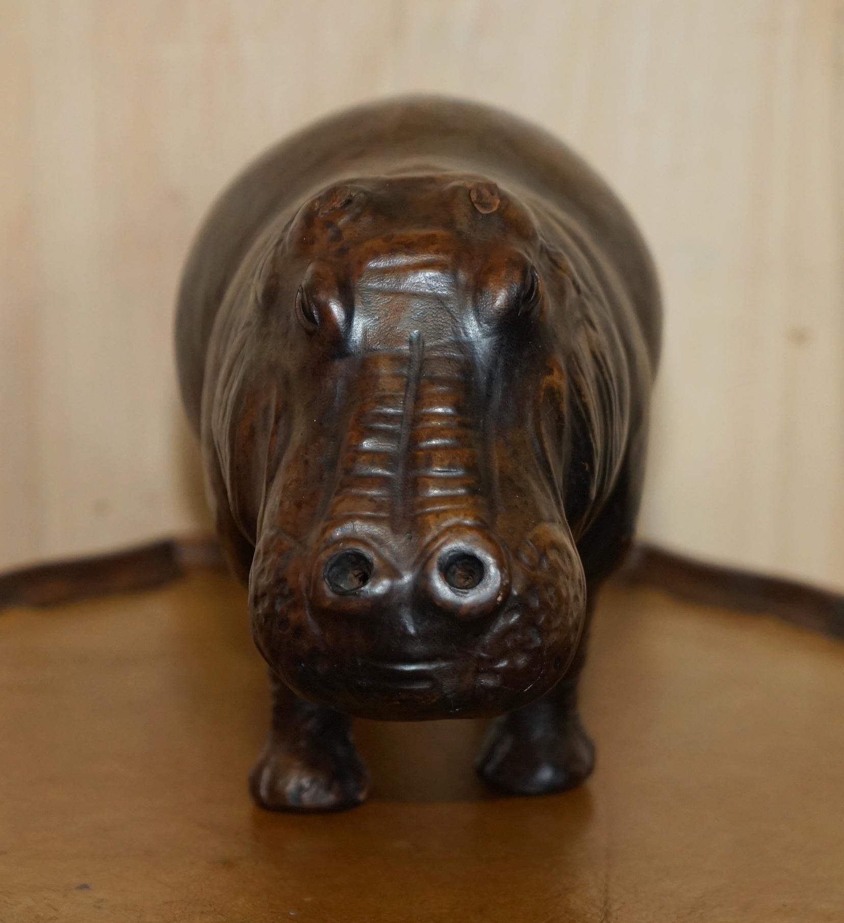 We are delighted to offer for sale this absolutely sublime very rare and original 1930’s Liberty’s London Omersa brown leather land dyed infant Hippo stool or footstool with original glass eyes.

These come in varying sizes, this is the small