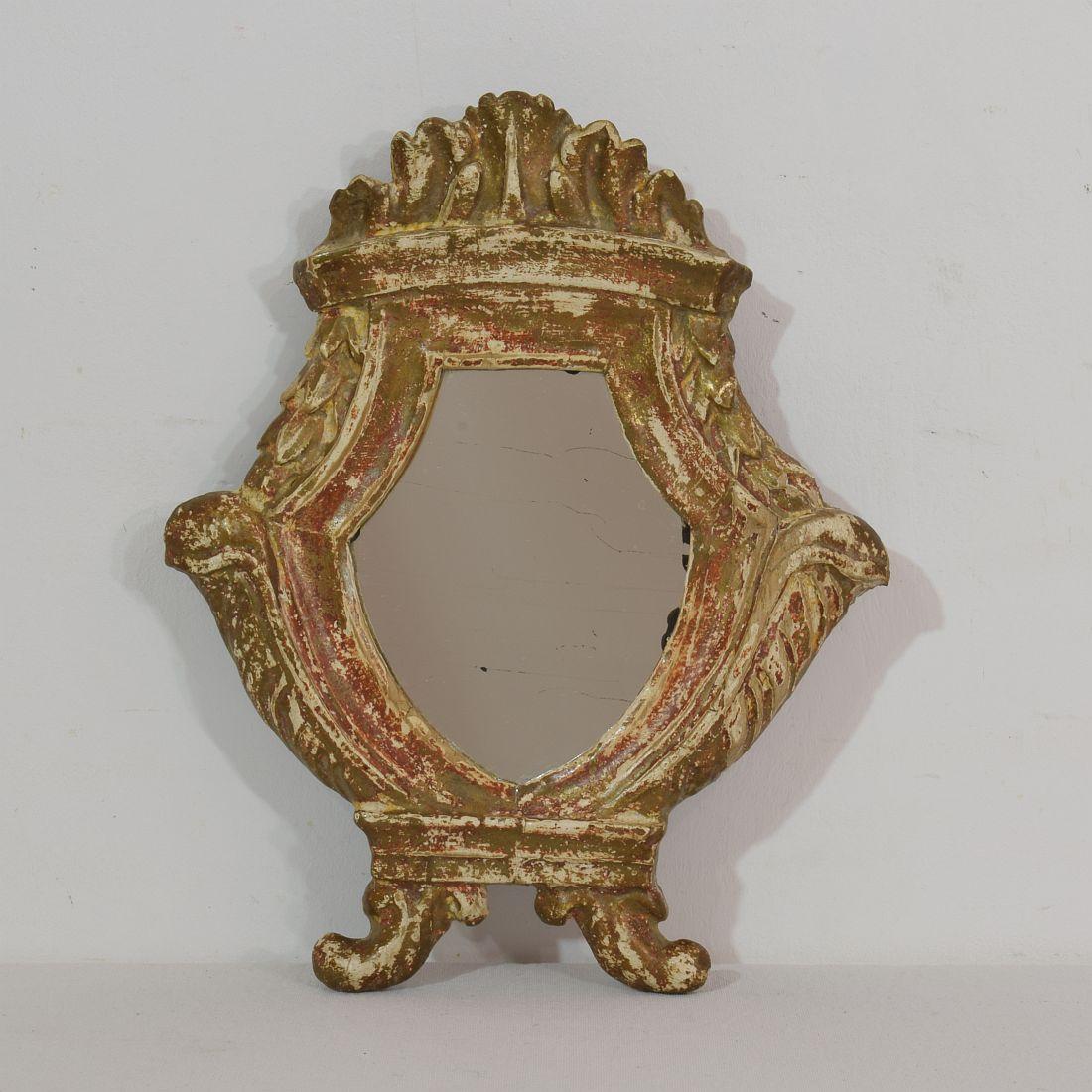 Very nice small neoclassical mirror, with traces of gilding. Italy, circa 1780. Weathered, small losses.