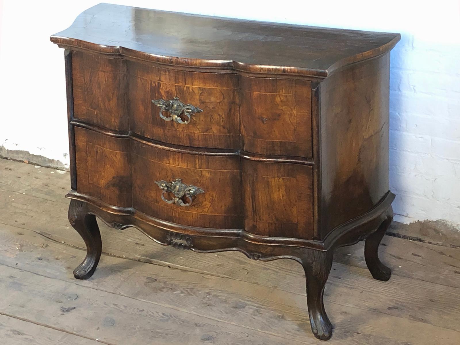 Small Italian 19th century Rococo Style Commode of petit size, Rococo style,  serpentine shape, on cabriole legs with wo drawers. Beautiful, rich patina.
Our pieces are left in lived-in condition, pending our custom conservation and polish to