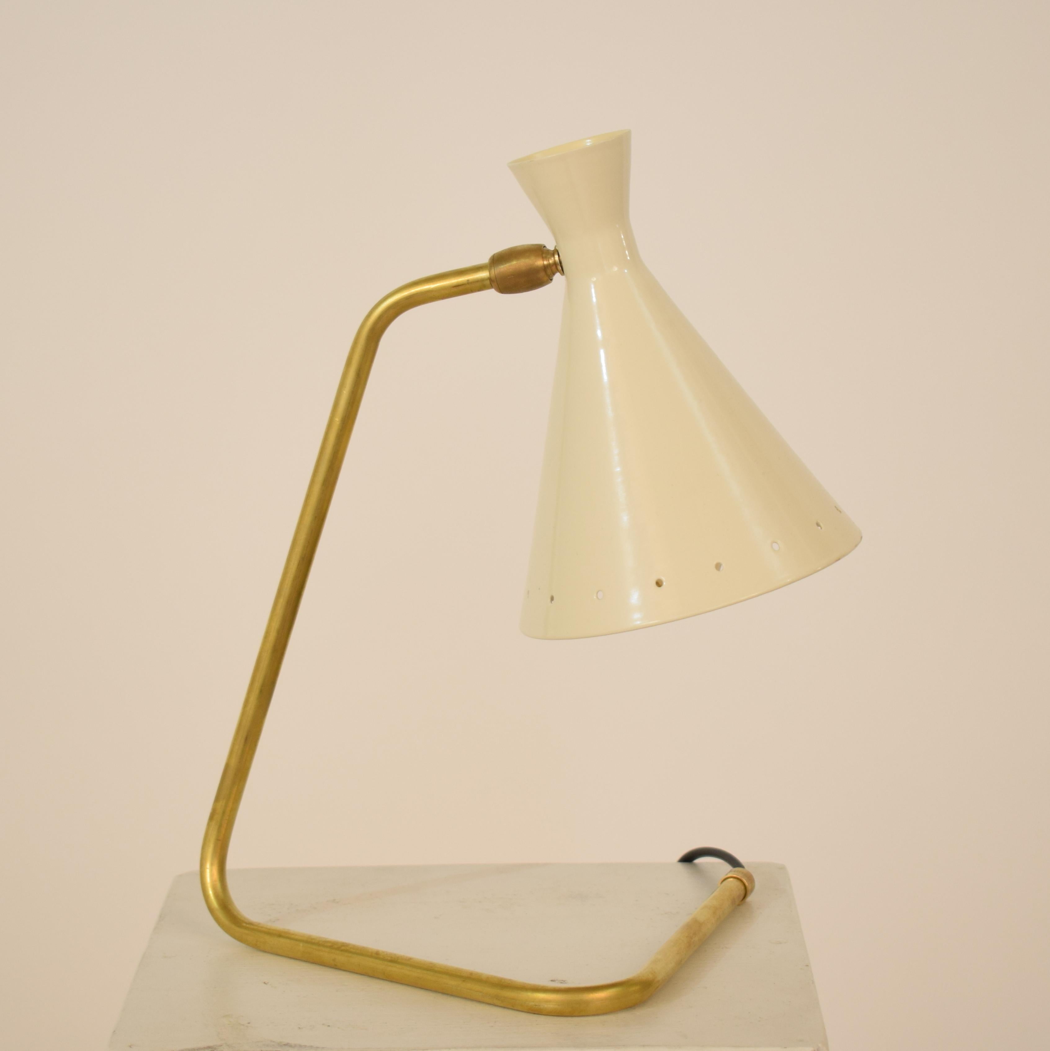 The beautiful modern small table Lamp in brass and lacquered metal is made in the style of Stilnovo.

A beautiful  piece which is a great eye-catcher for your antique, modern, space age or mid-century interior.
If you have any more questions we are