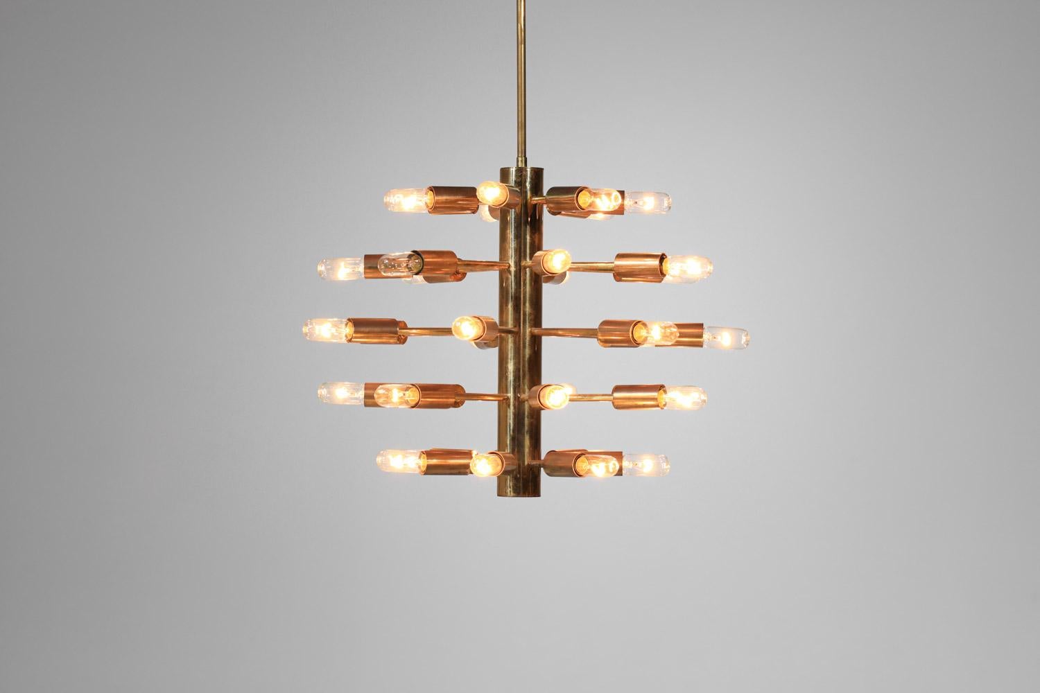 Italian pendant light from the 60s attributed to Stilnovo. Structure of the chandelier without lampshade and fixing bar in solid patinated brass. Very beautiful, sober and elegant, quite original design. Beautiful patina of time on the entire